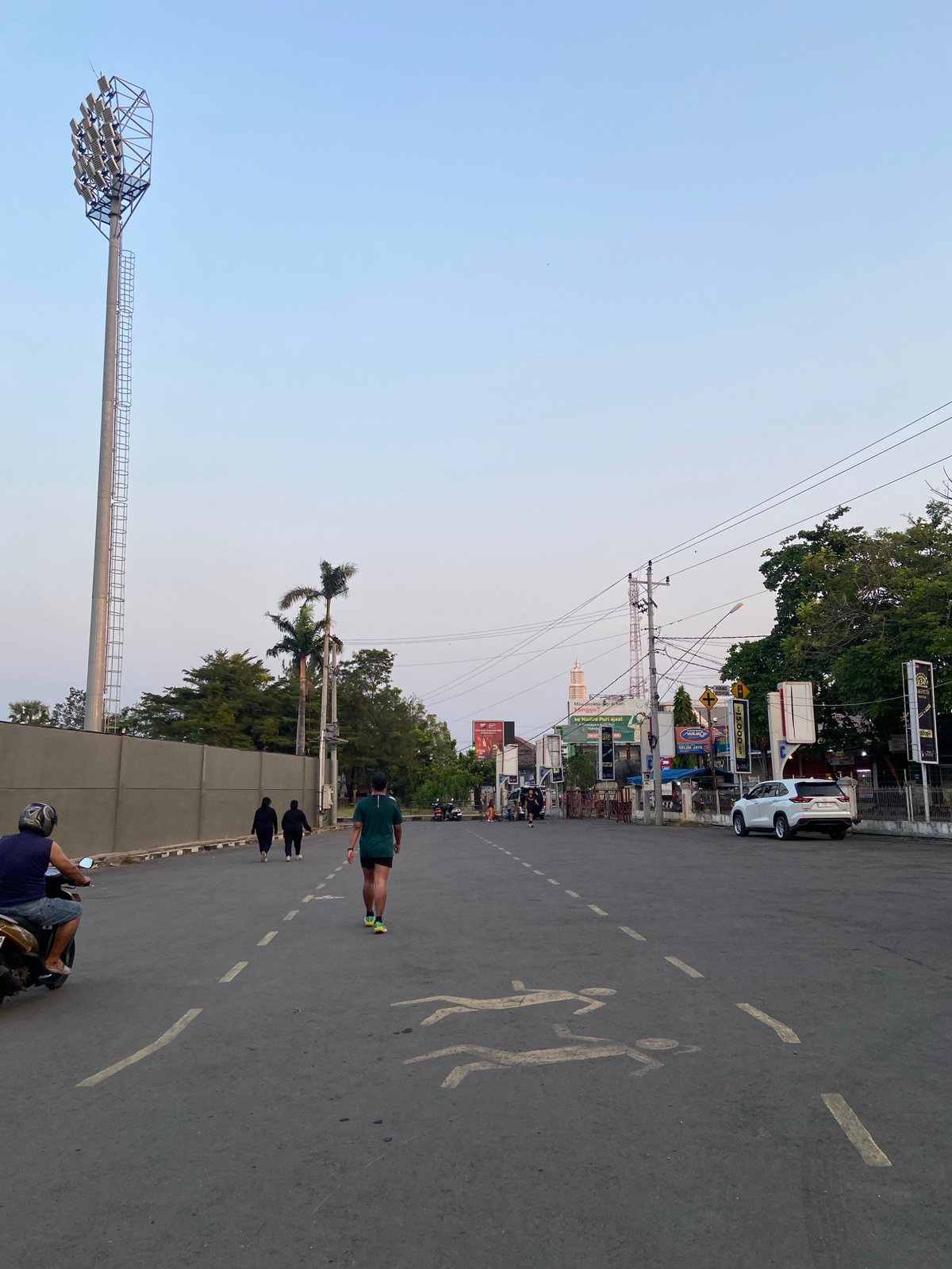 Morning activity around a stadium in Margorejo, Indonesia