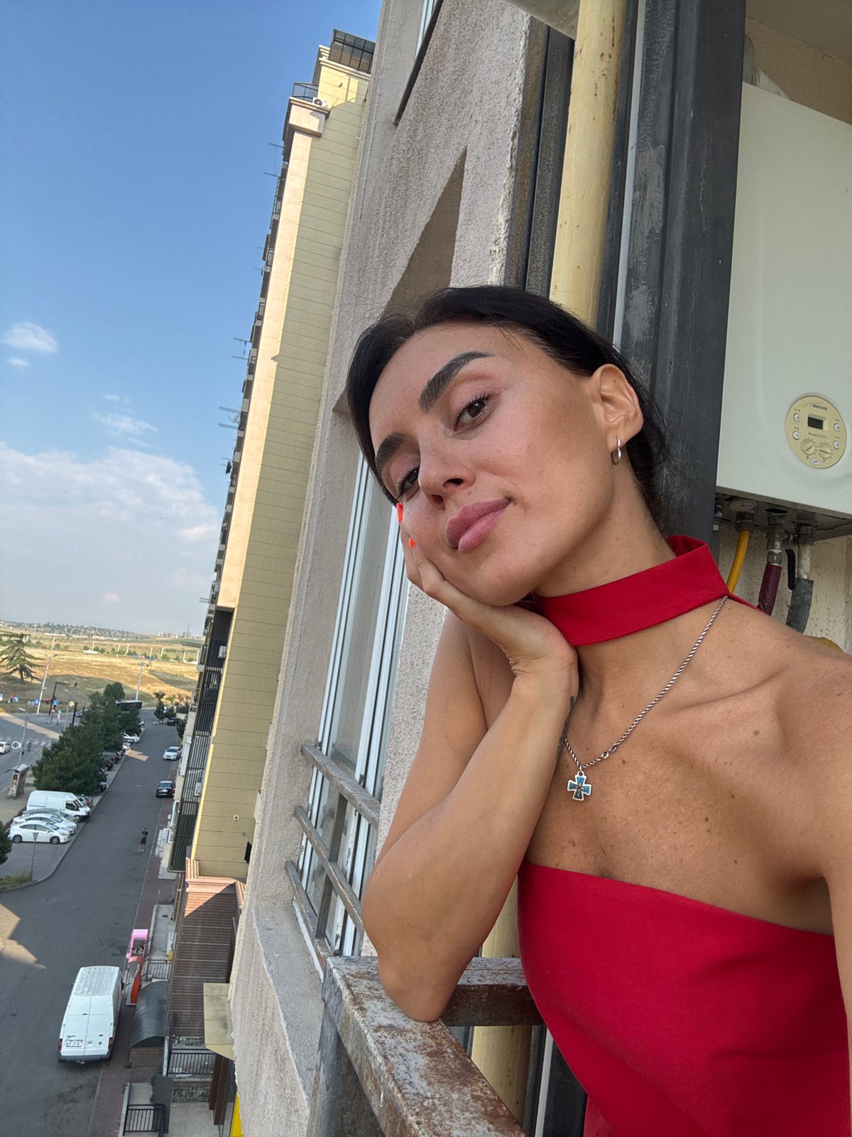 Late-night selfie session across a Tbilisi balcony and apartment interior