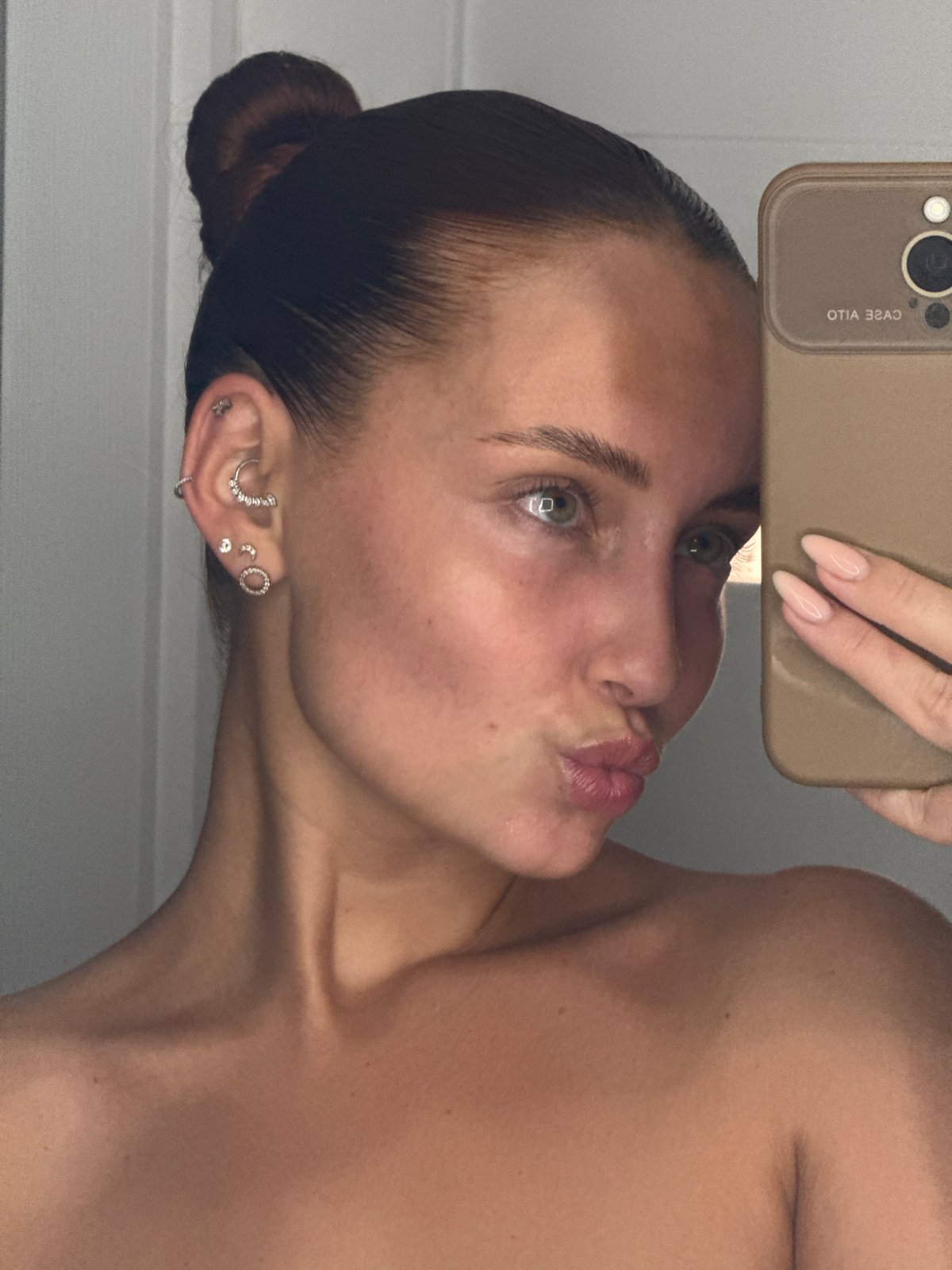 Woman takes multiple selfies in Chaikovsky, Russia evening
