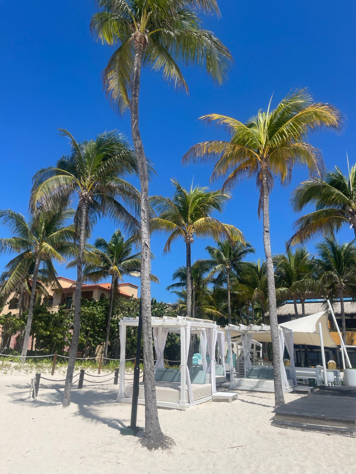 Resort visitor counts aloud at Playa del Carmen beach