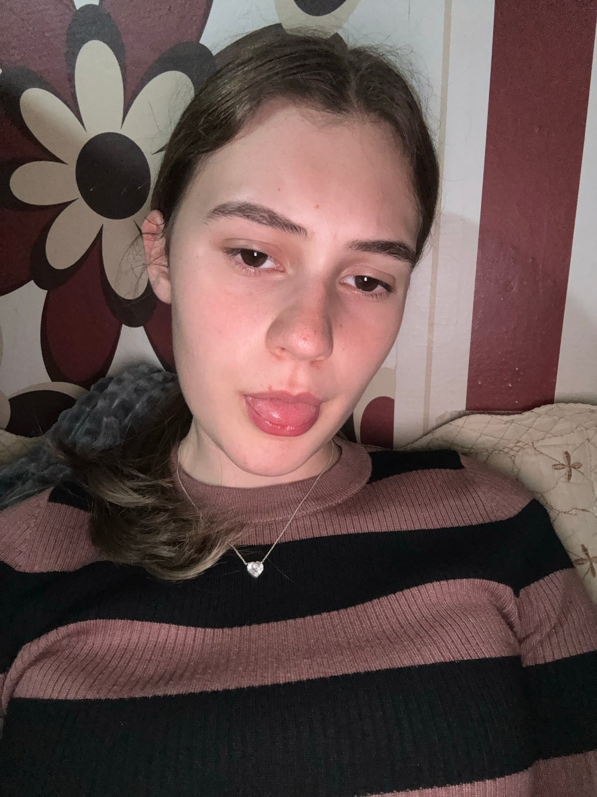 Woman makes playful expression in indoor photo, Panagyurishte