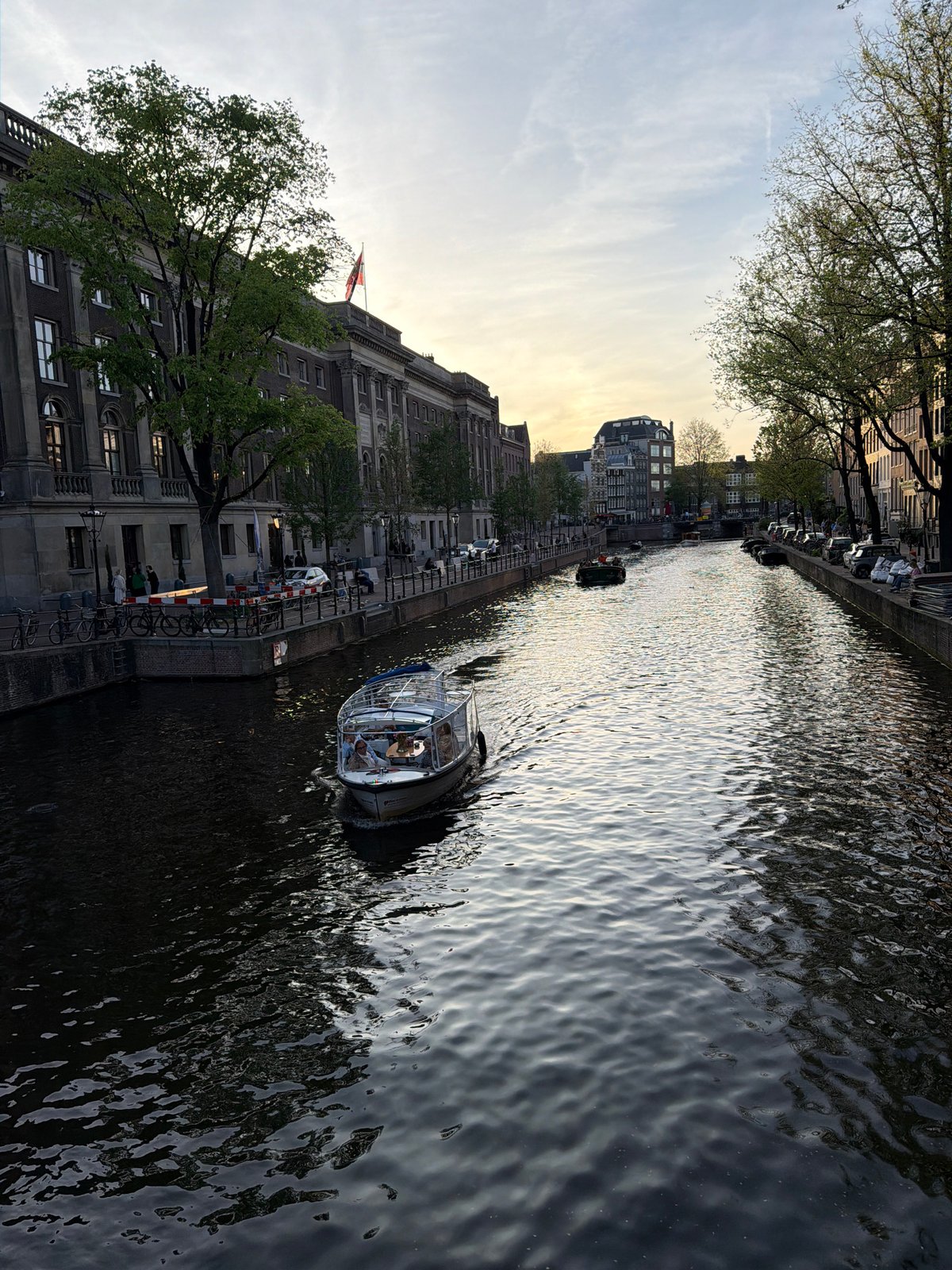 Evening canal scenes and decorated bicycle captured in Amsterdam