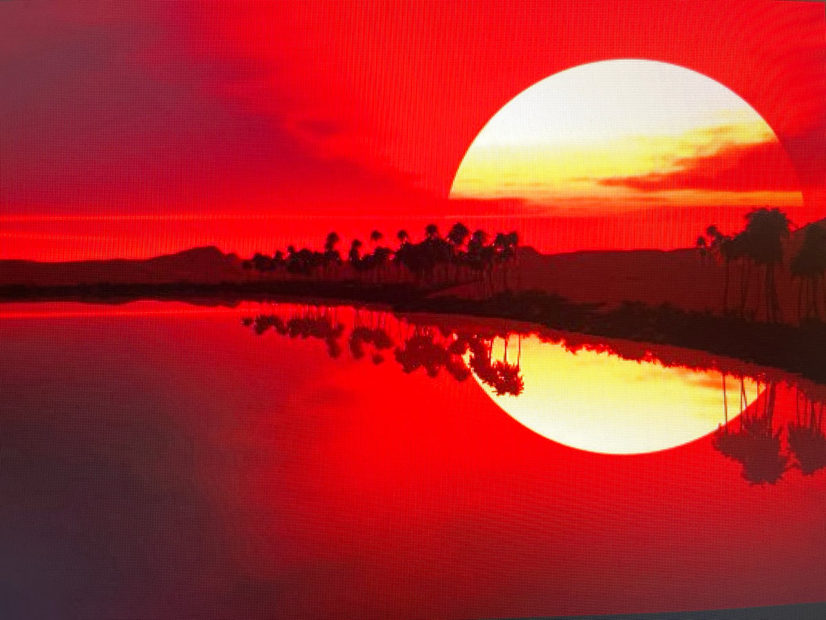 Fiery sunset over water on the Kharkiv horizon