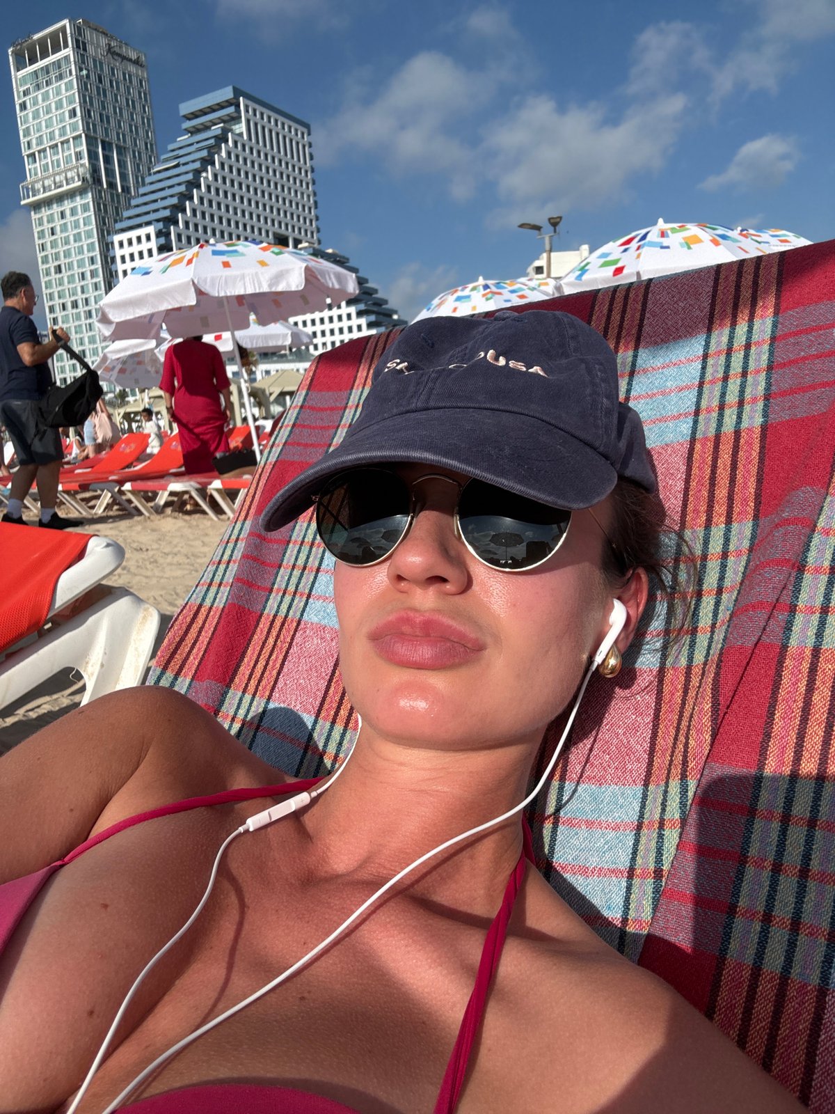 Midday at a Tel Aviv beach, chairs and umbrellas out