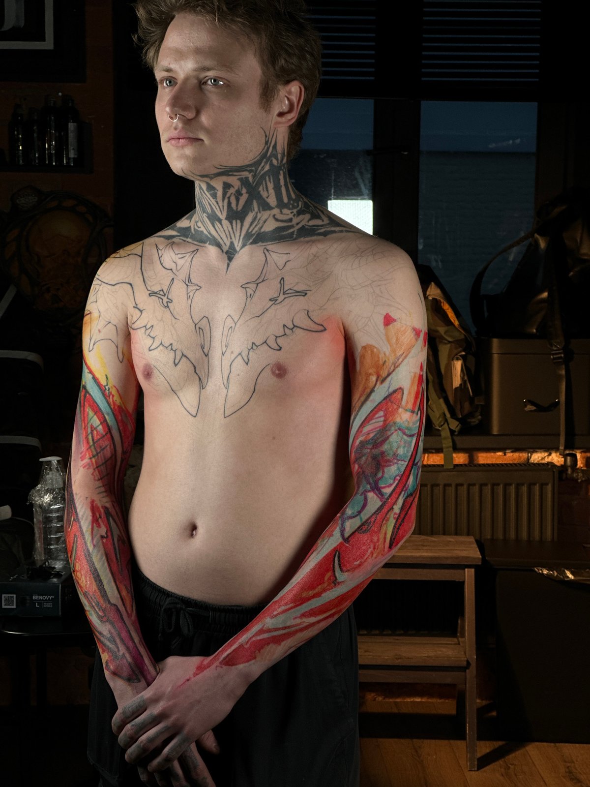 Tattooed man photographed during Moscow studio session