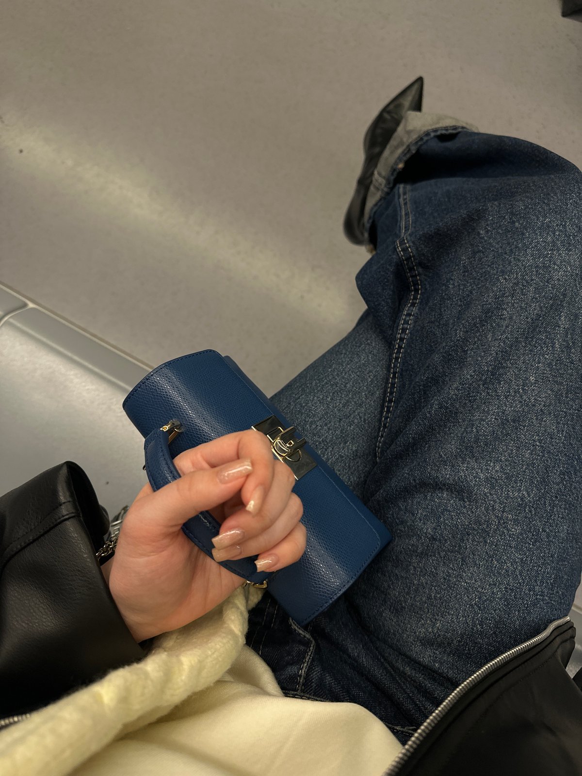 Person spotted sitting with blue handbag in Sofia