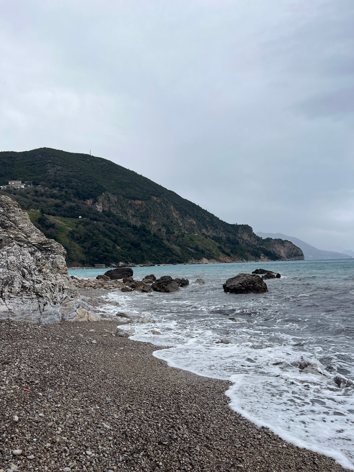 Overcast coastal scene captured at Prijevor Montenegro pebble beach