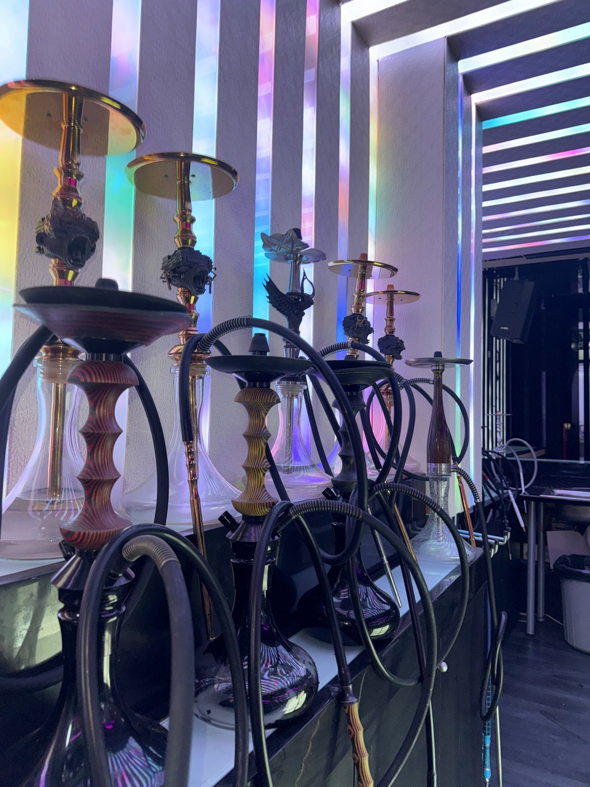 Ornate hookahs displayed in dimly lit Blagoevgrad setting