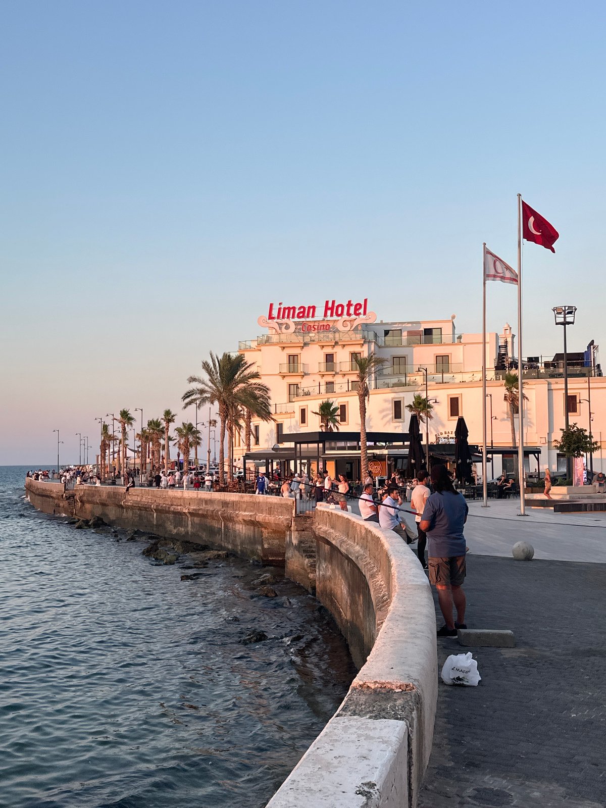 Sunset along the Kyrenia waterfront, flags and all.