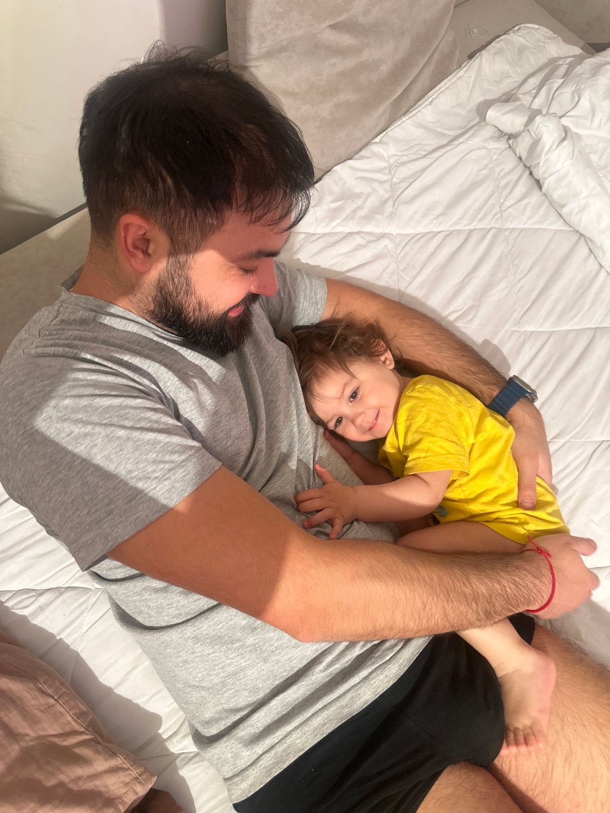Father and toddler share quiet moment in Gavrilkovo
