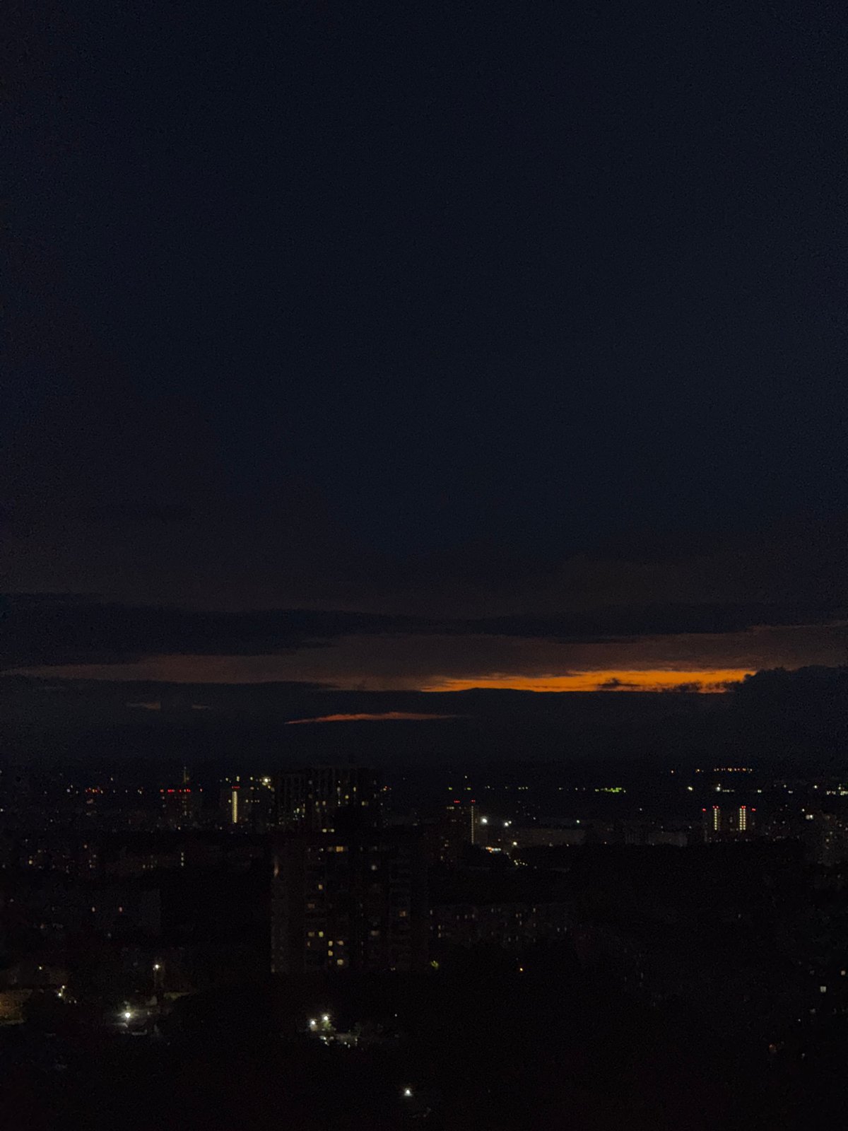 Orange clouds illuminate nighttime sky over Гамово, Russia