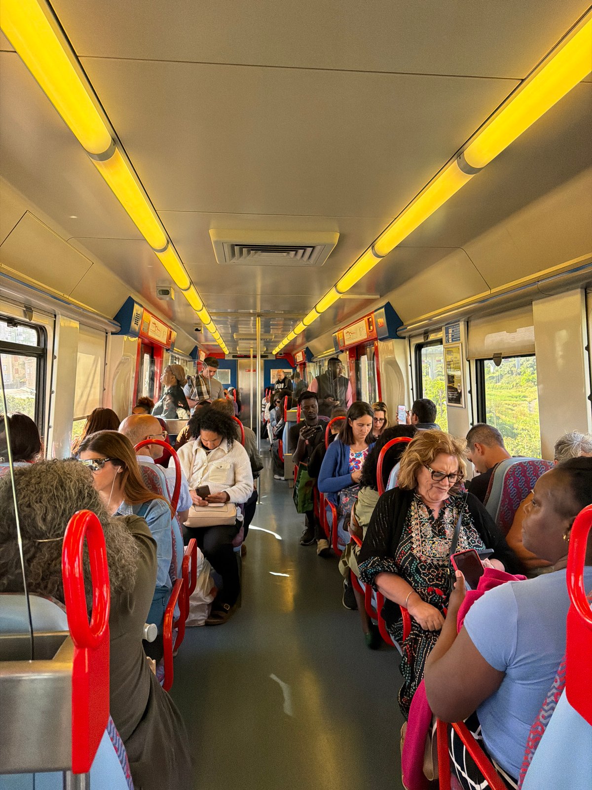 Routine commuter moments captured on Lisbon metro train