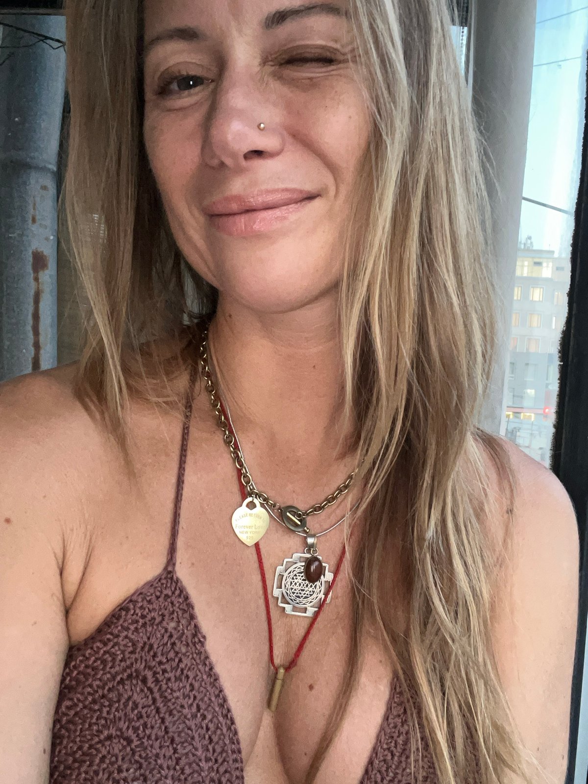 Casual selfie in Samara, brown knit top and layered necklace