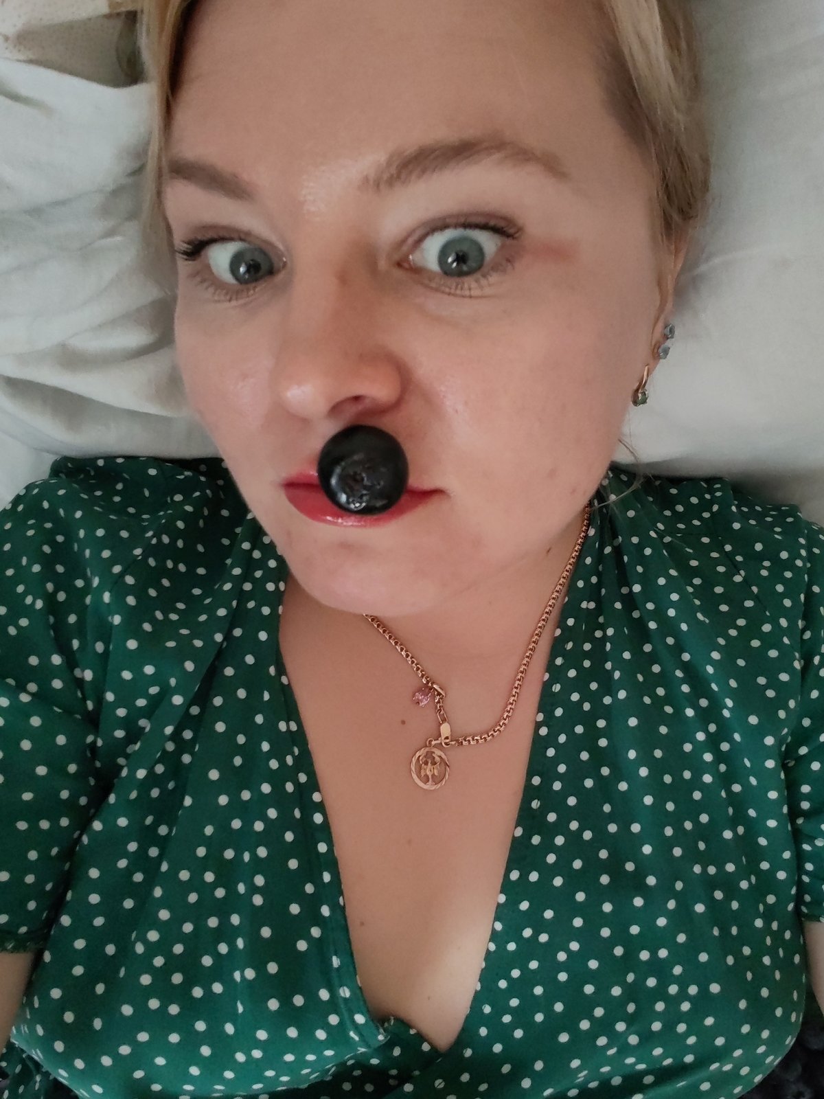 Woman enjoys fresh blueberries during morning snack in Izhevsk