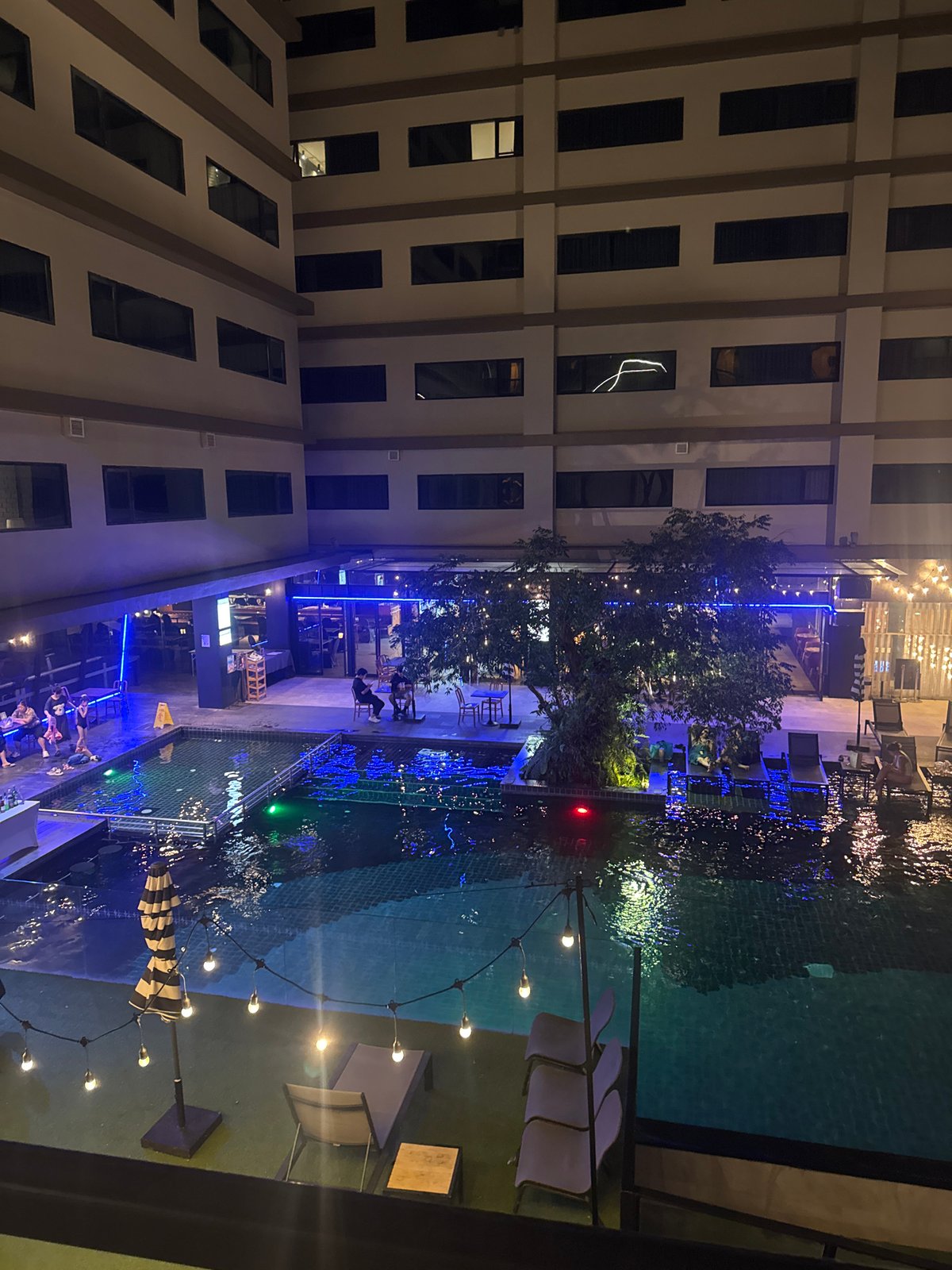 Hotel courtyard pool shot from above at night