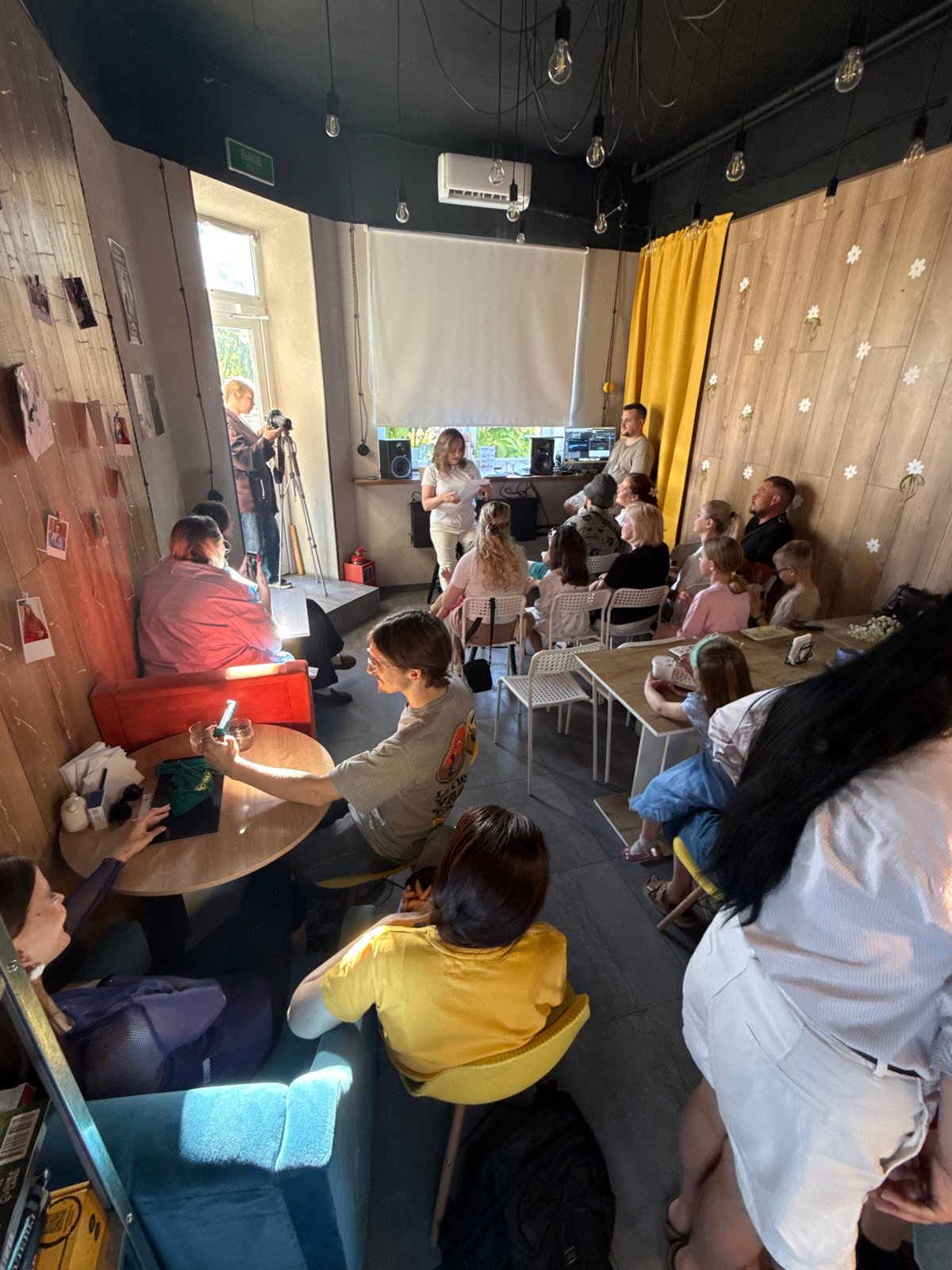 Community gathering with singing performance recorded in Balashikha cafe