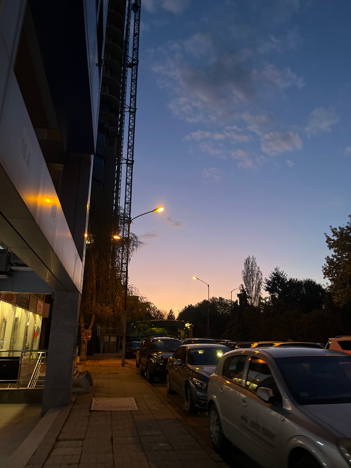 Evening street life captured around Sofia's Hotel Marinela district