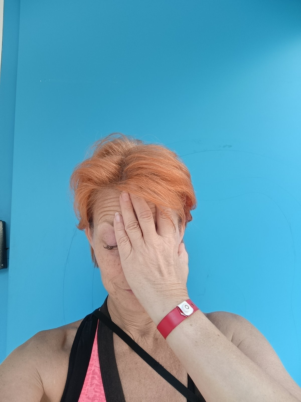 Moscow witnesses capture woman in sportswear, digital emoji display