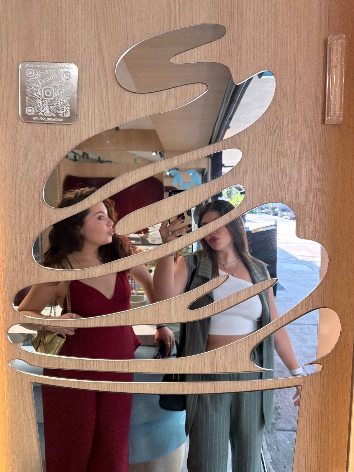 Friends document ice cream shop visit with mirror selfies