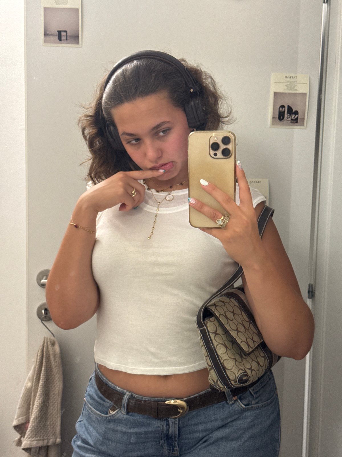 Mirror selfie session in a Milan fitting room, July 2026