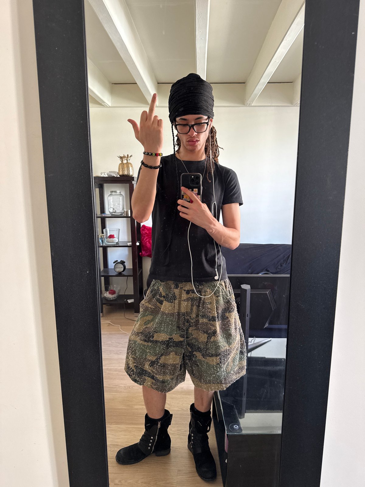 Person takes mirror selfie in distinctive outfit in Paris