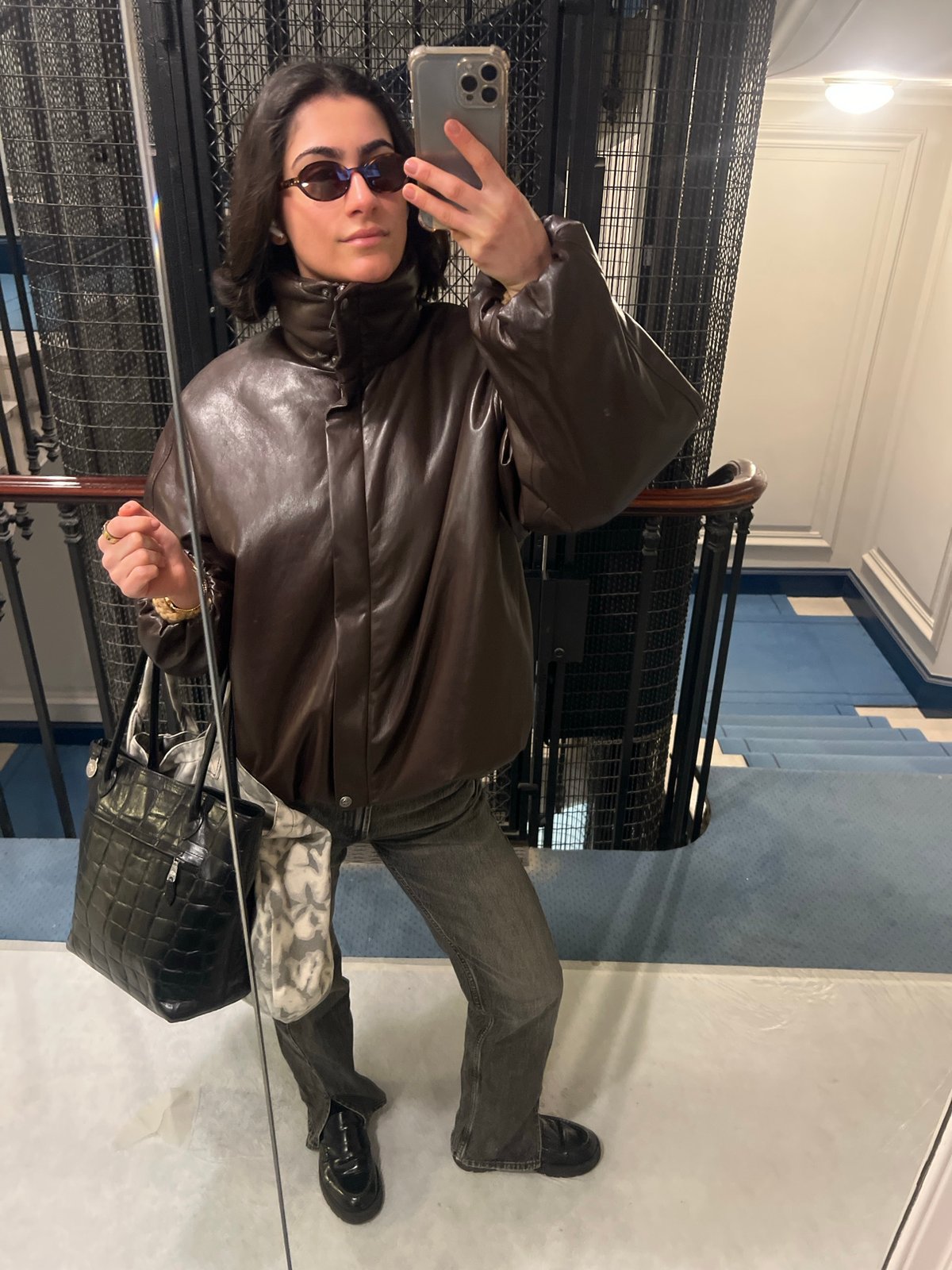 Woman takes elevator selfie in Paris