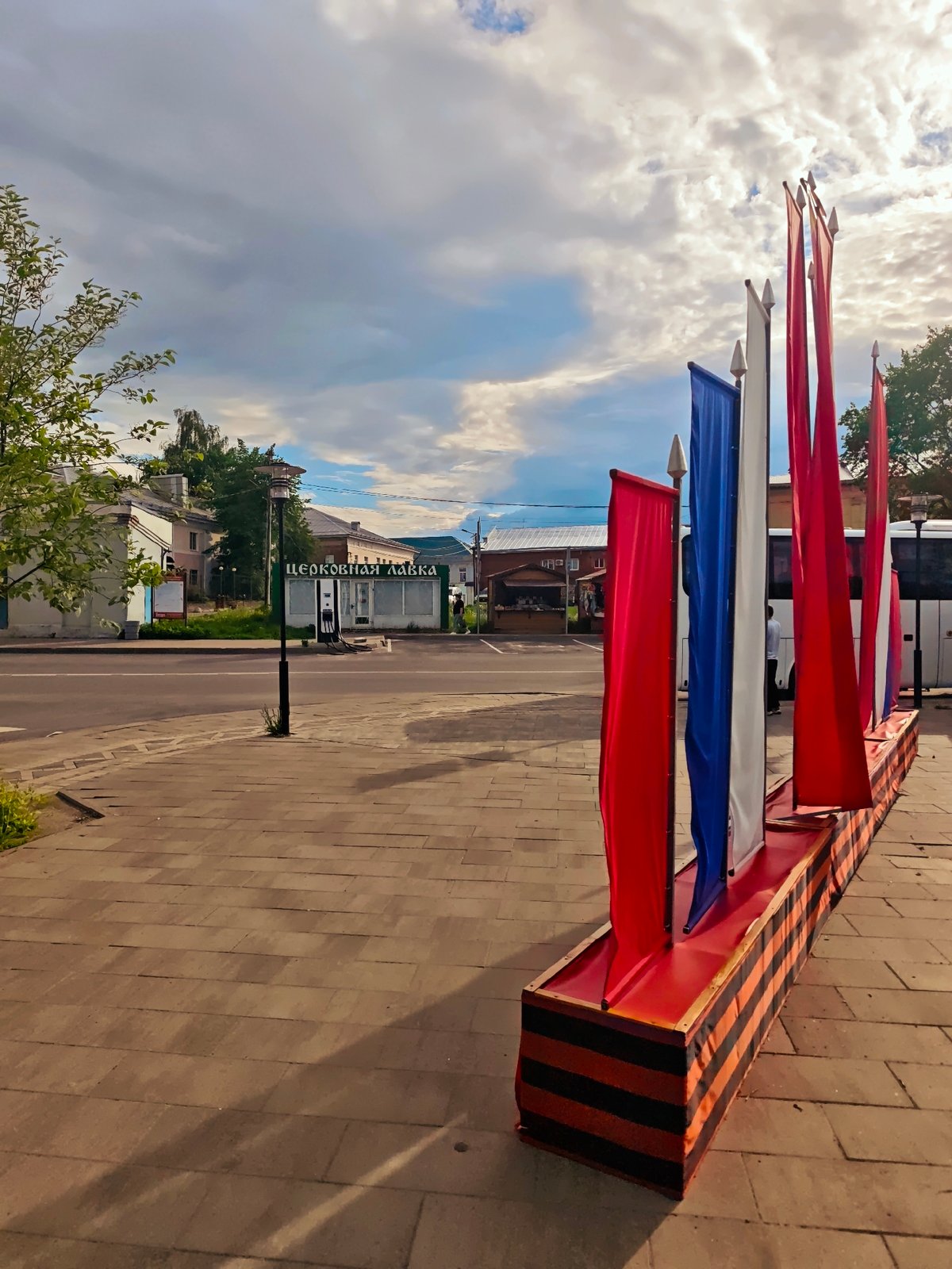 Urban scenes captured: flags, marketplace activity, civic architecture