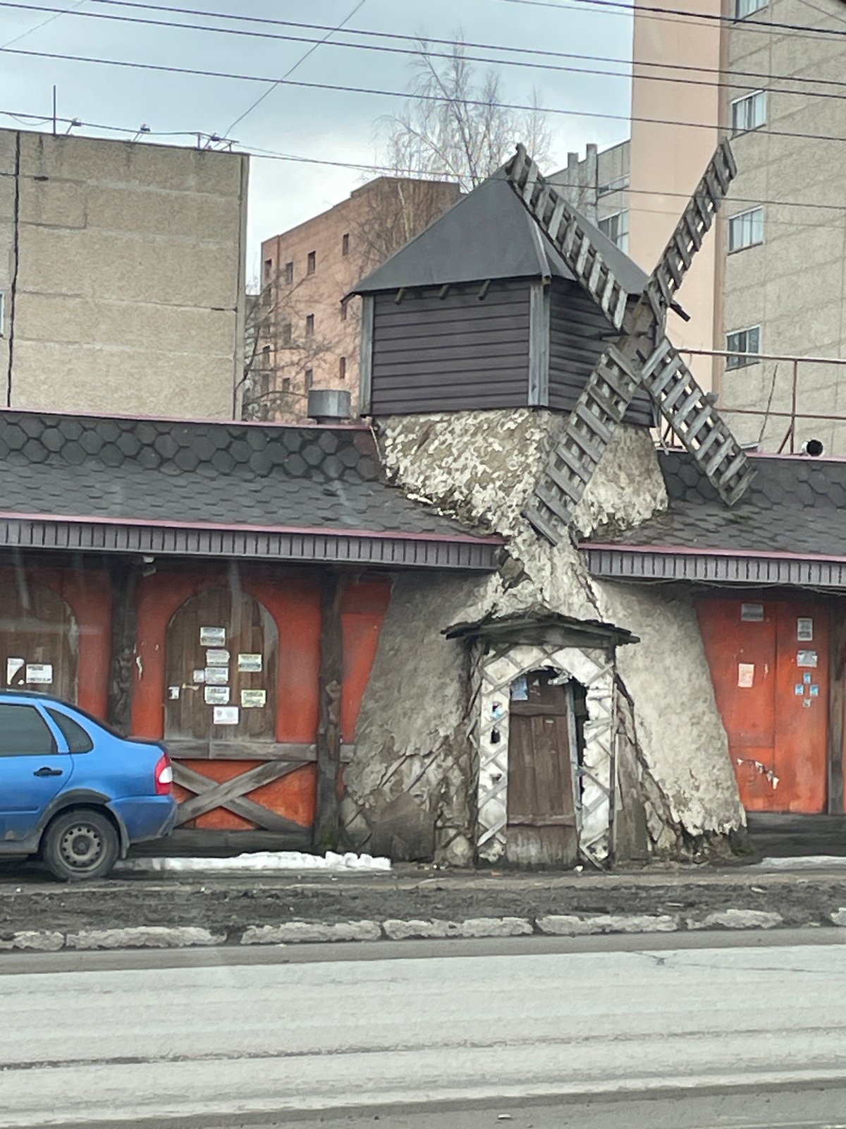 Quiet moments captured around Izhevsk including windmill, resting traveler