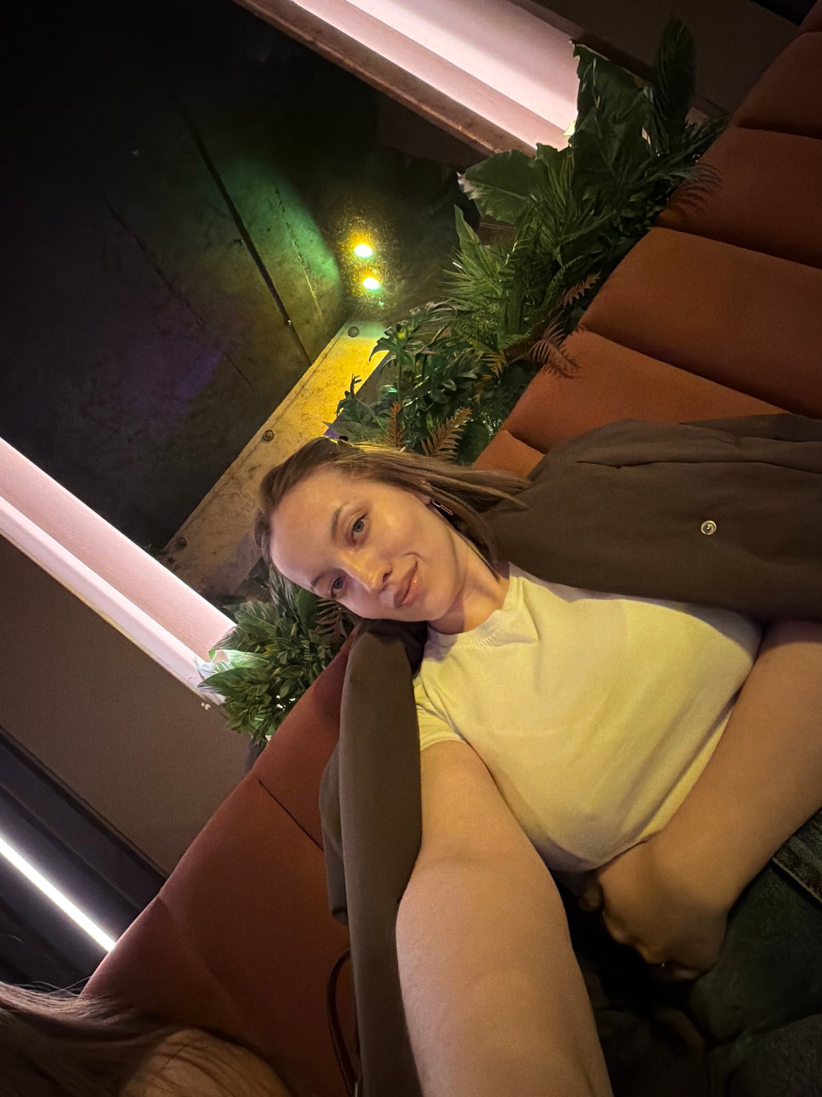 Woman takes selfies at Moscow restaurant during lunch hour