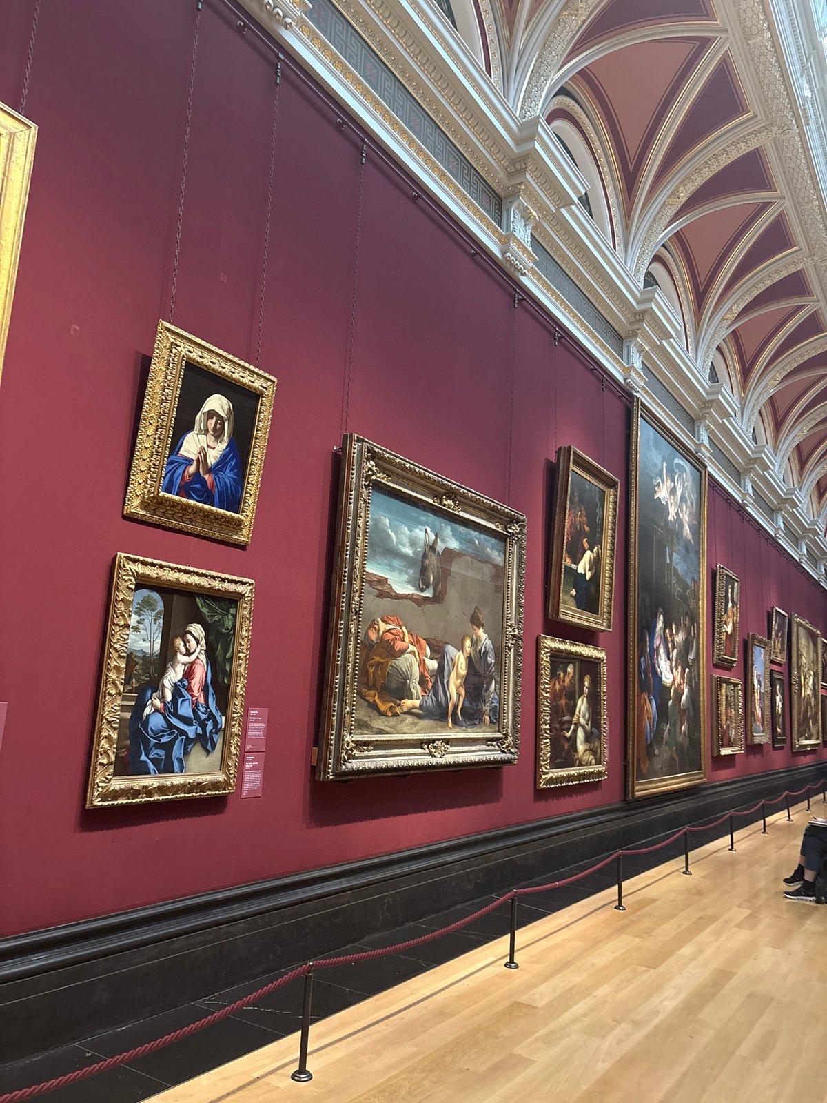Religious artwork observed on red wall at National Gallery