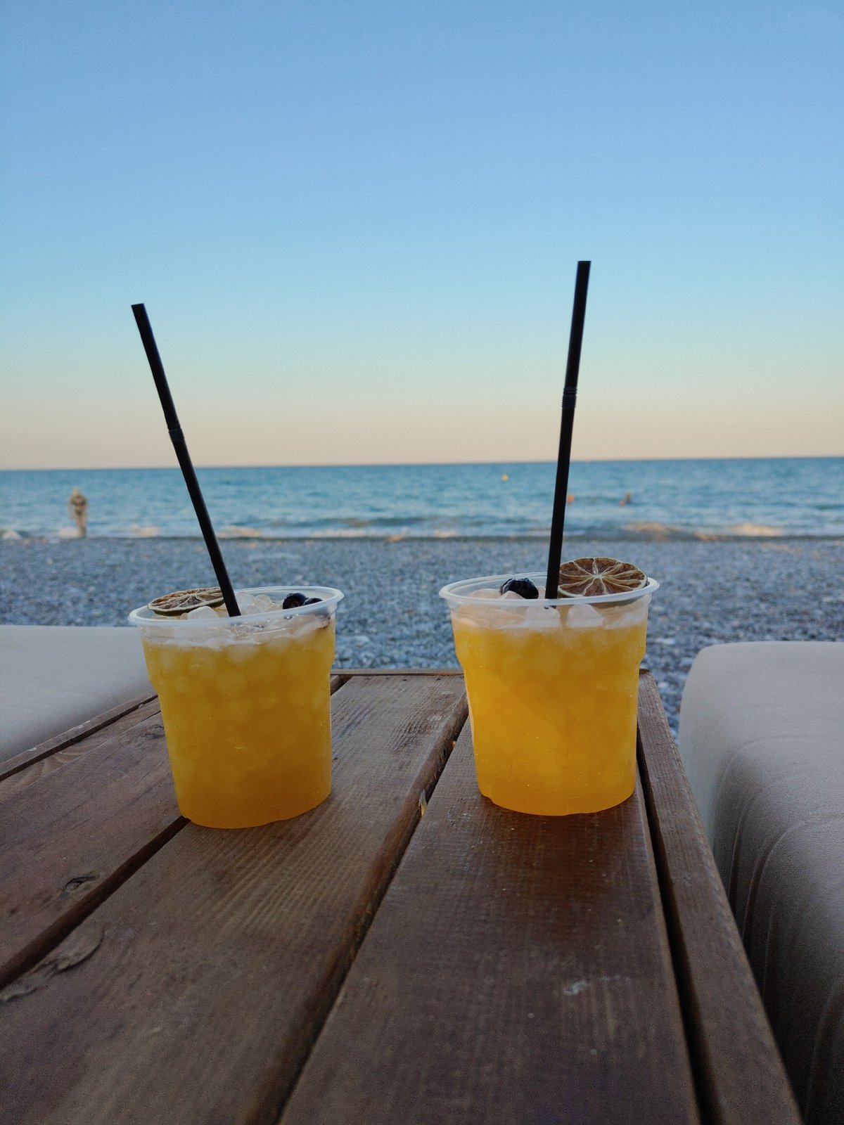 Summer afternoon on the Greek coast, kites, beaches, and cold drinks