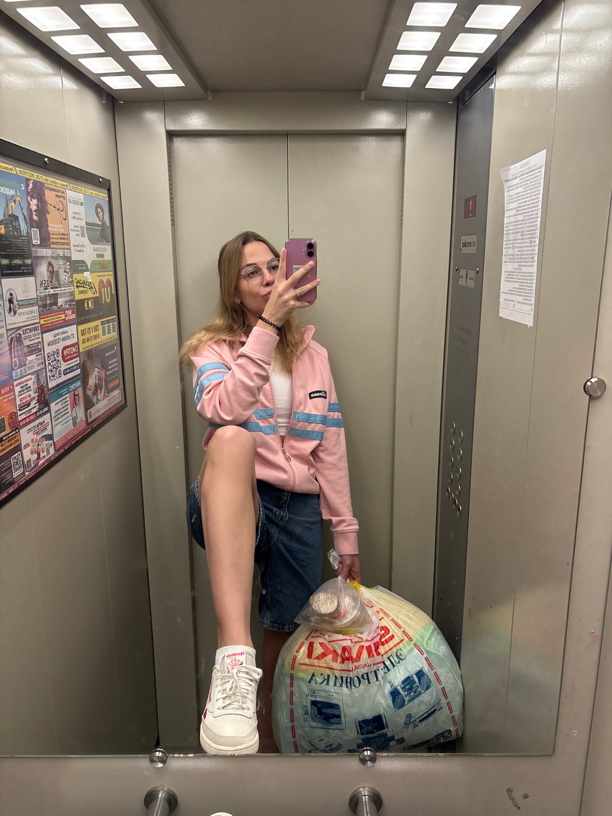 Woman takes elevator selfie in Ust-Ilimsk, Russia