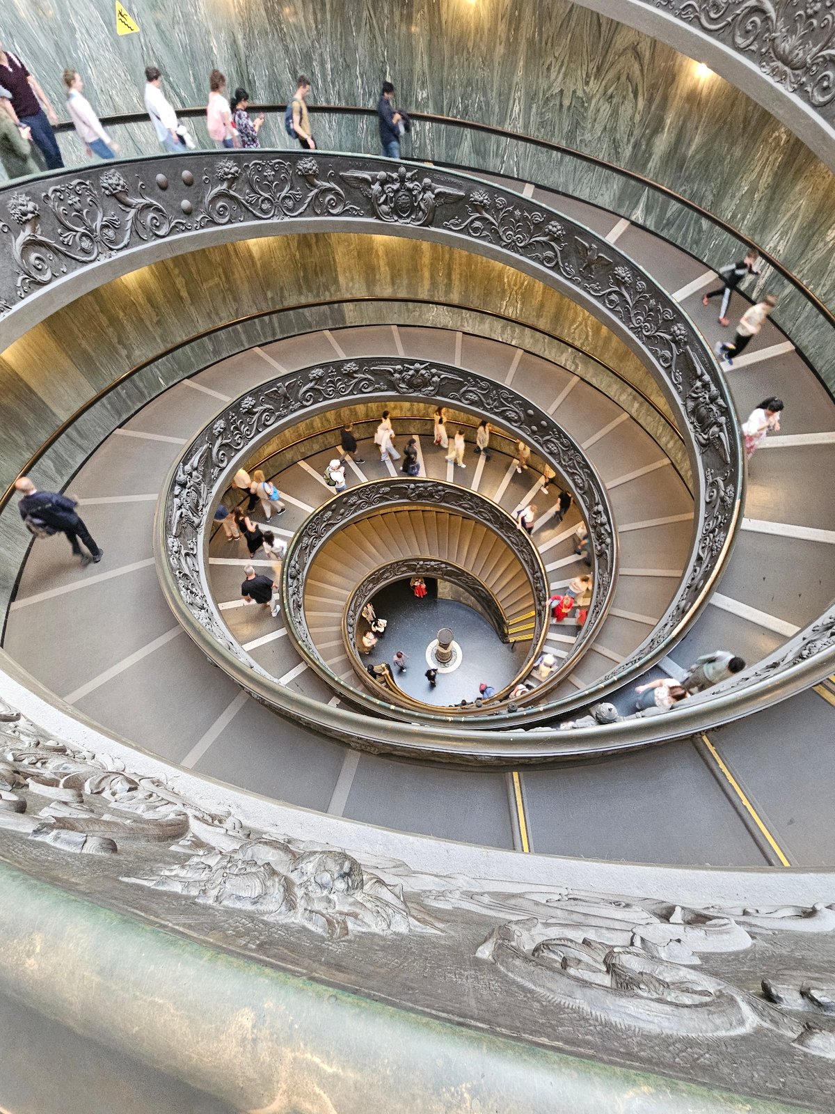 Visitor documents Vatican museum artifacts and sculptures