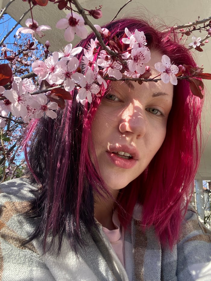 Magenta-haired individual photographed repeatedly in Montenegro village