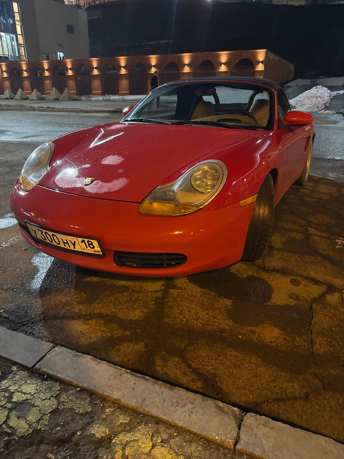 Red Porsche spotted on wet Izhevsk street