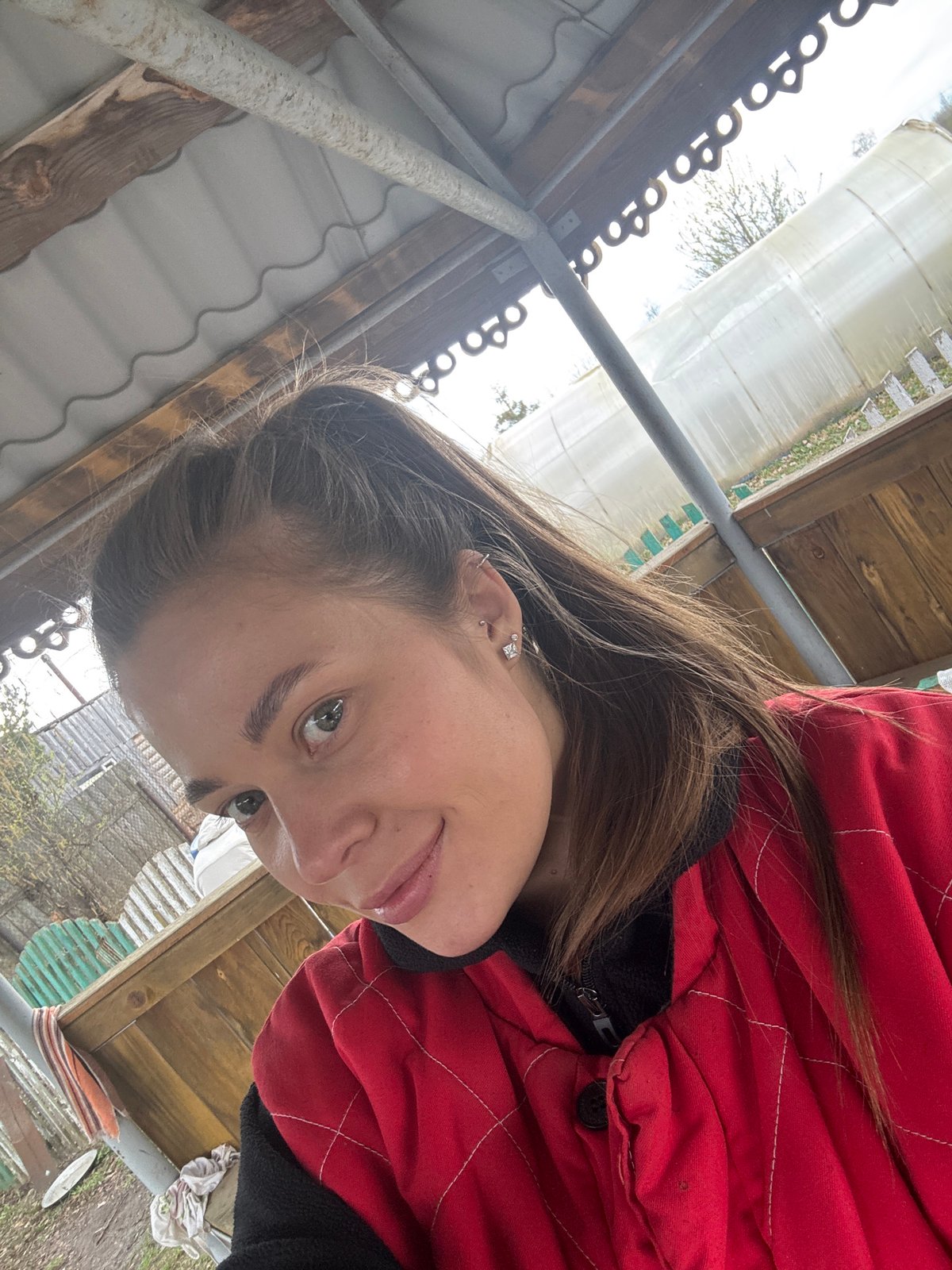Woman takes outdoor selfie in Сульмаш, Russia