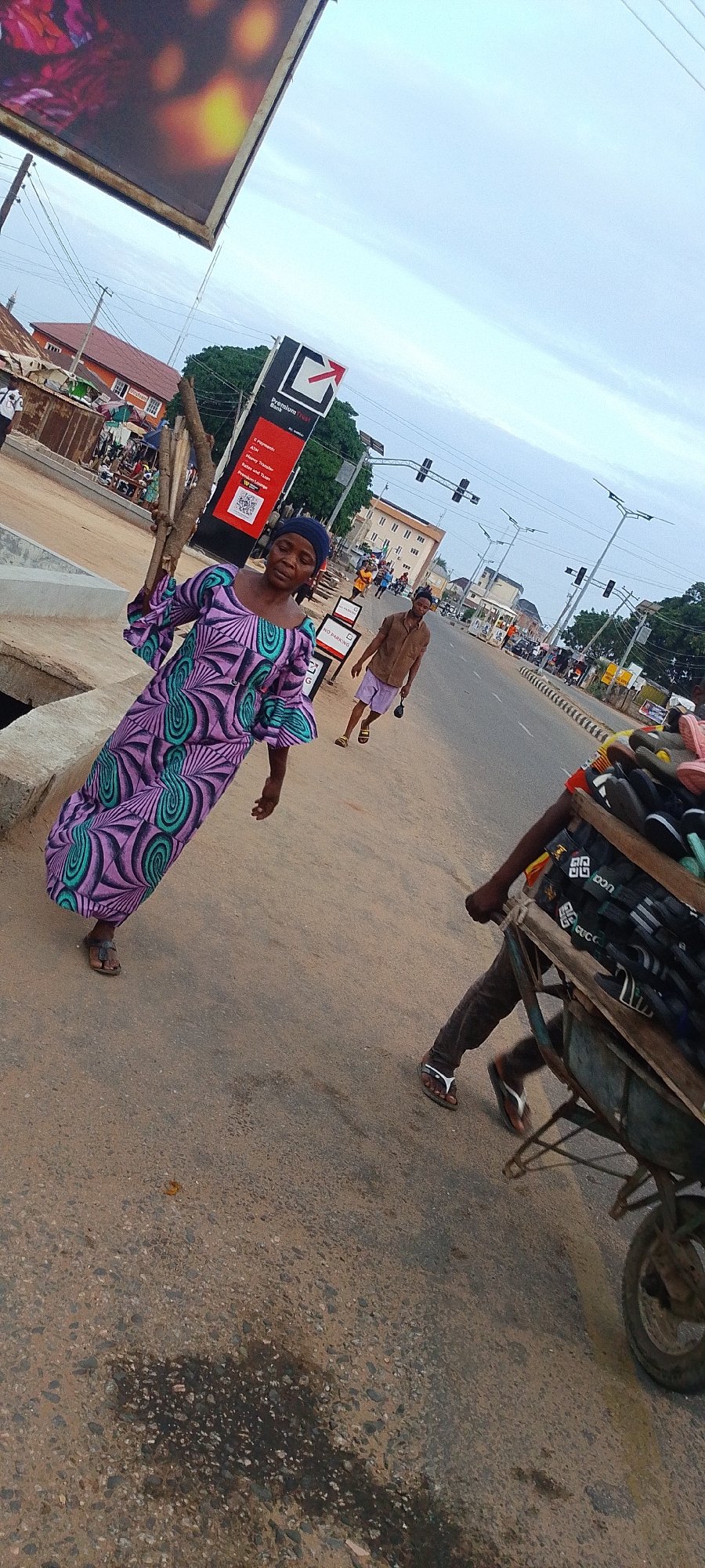 Daily street commerce and police presence in Lokoja Nigeria