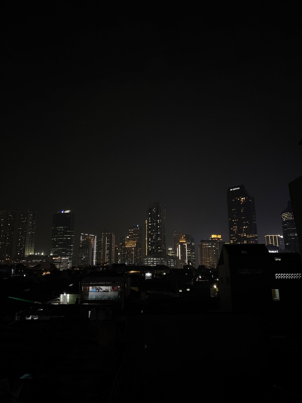 Nighttime South Jakarta skyline captured showing illuminated commercial towers