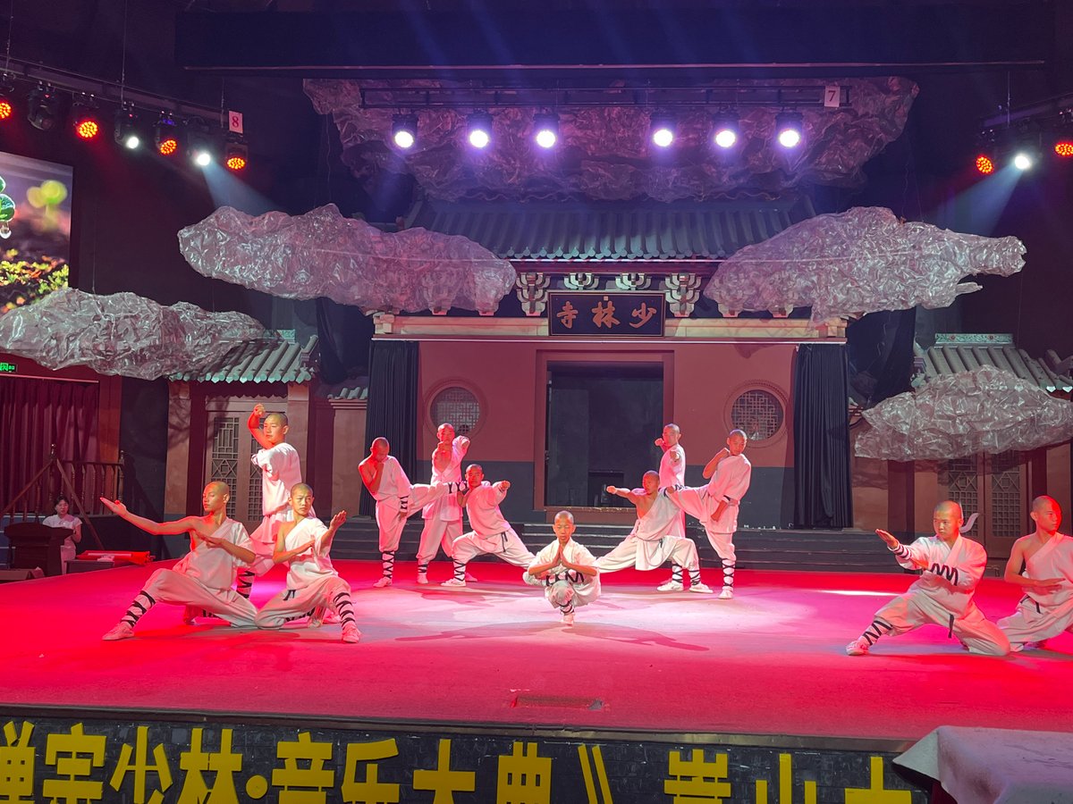 Shaolin martial arts troupe performs on stage and temple grounds