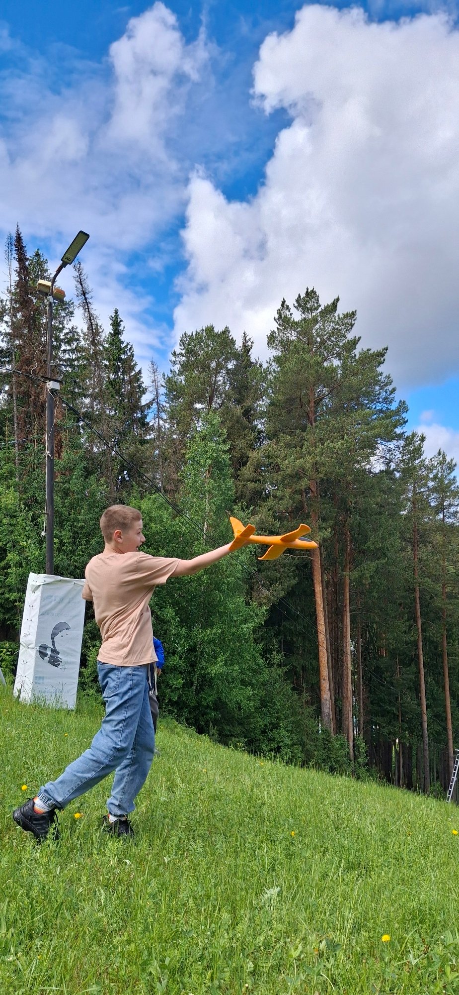 Family enjoys outdoor play session in Прикамский forest area