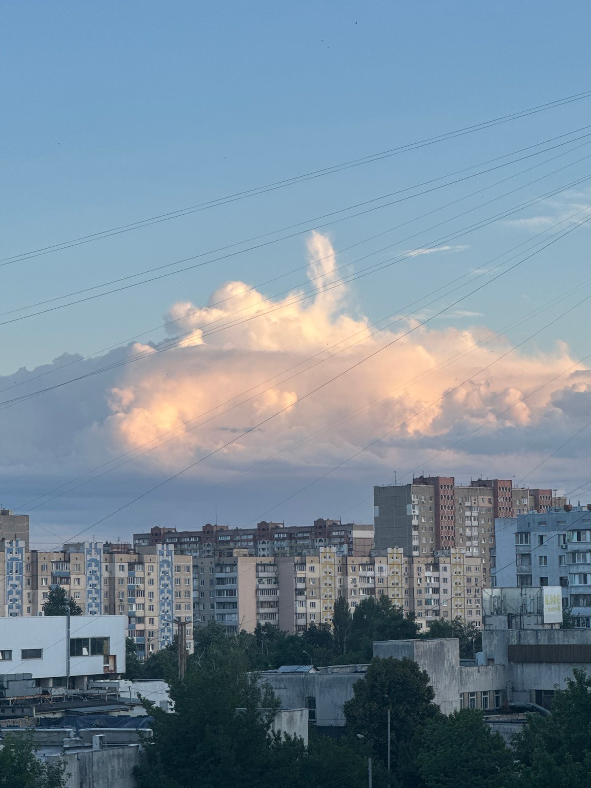 Kyiv residential skyline, mixed architecture under cloudy skies