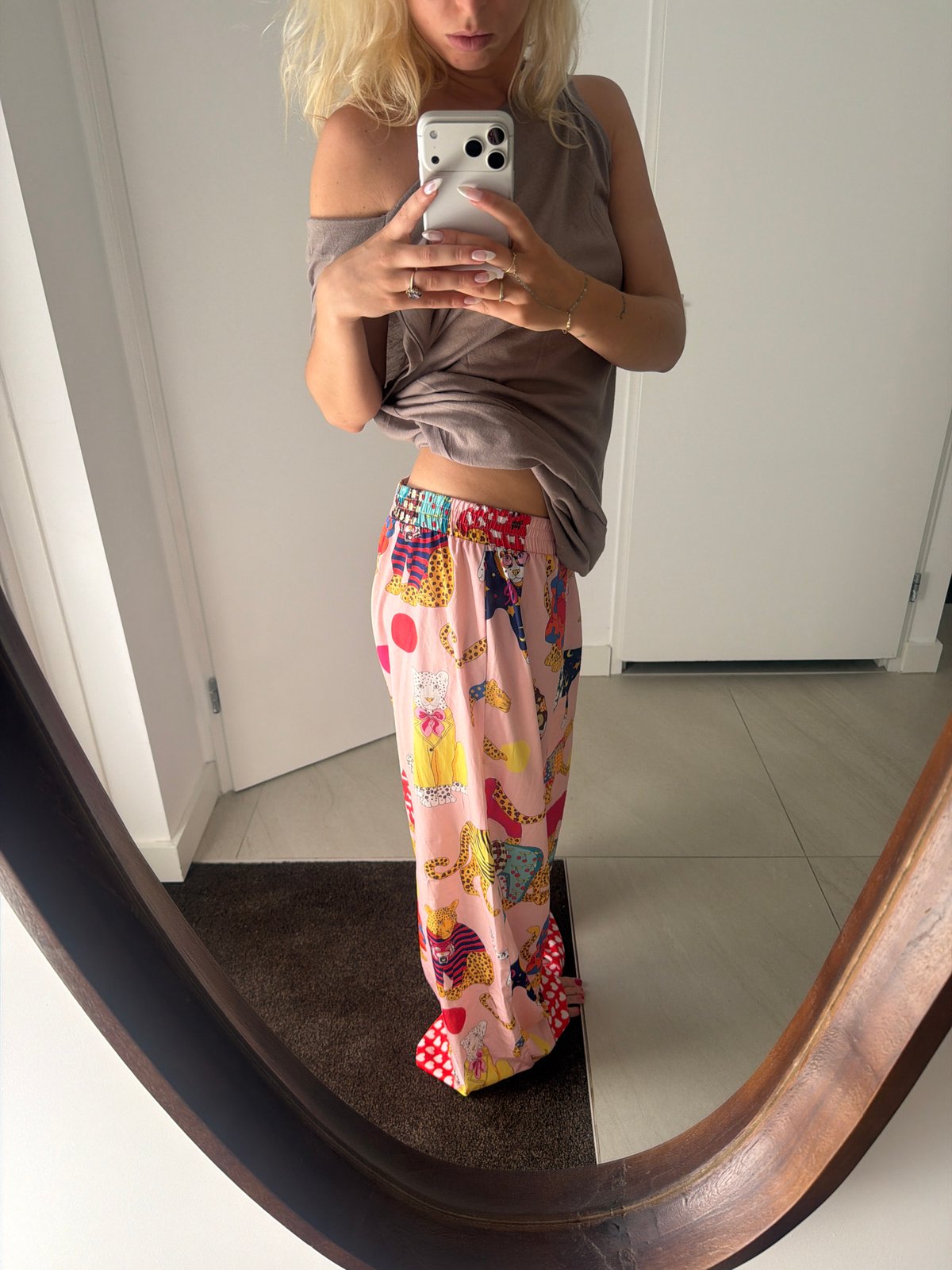 Mirror selfie series in a Ridderkerk home, same outfit, three angles.