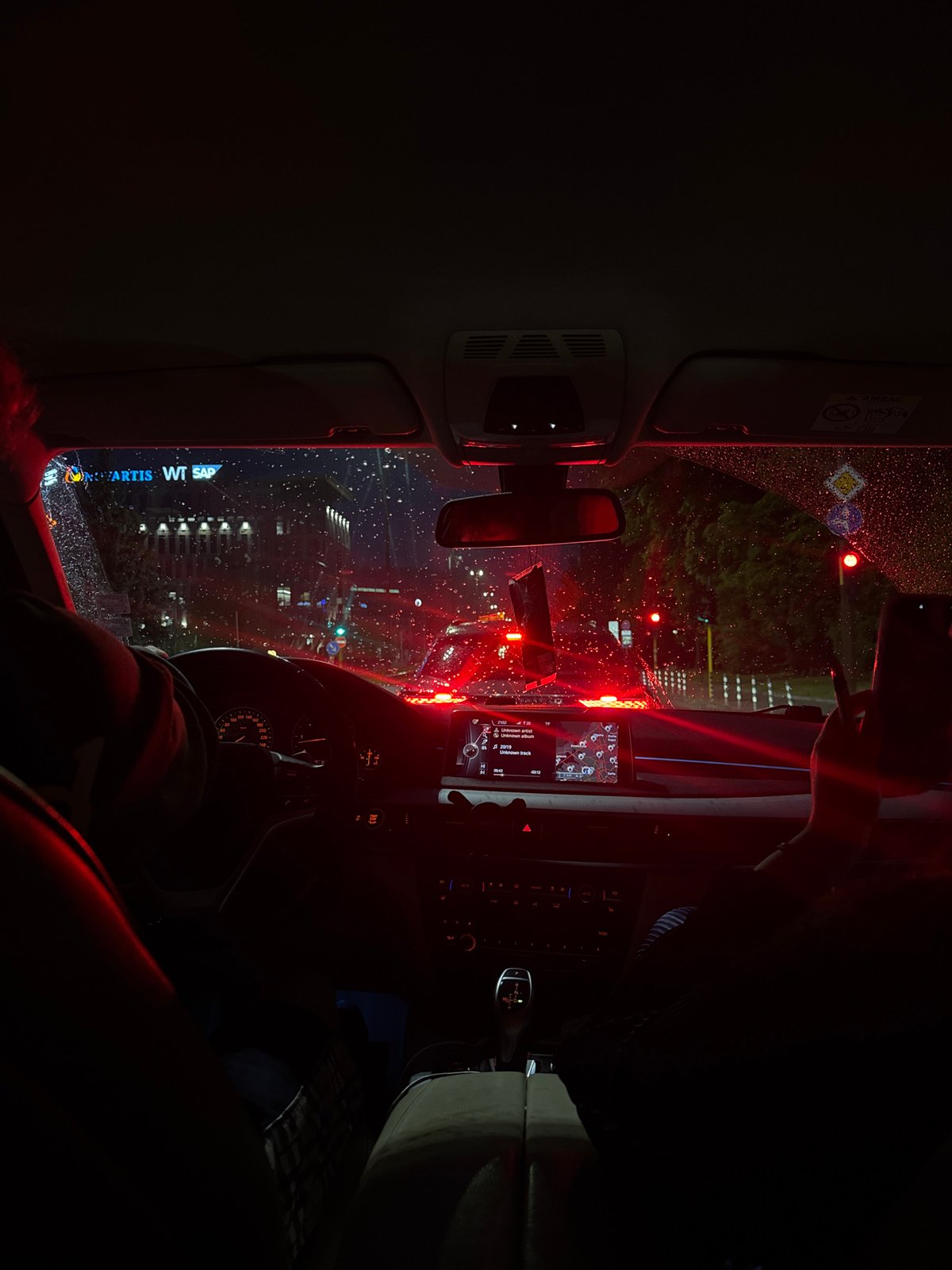 Rainy evening cityscape viewed from car interior in Sofia