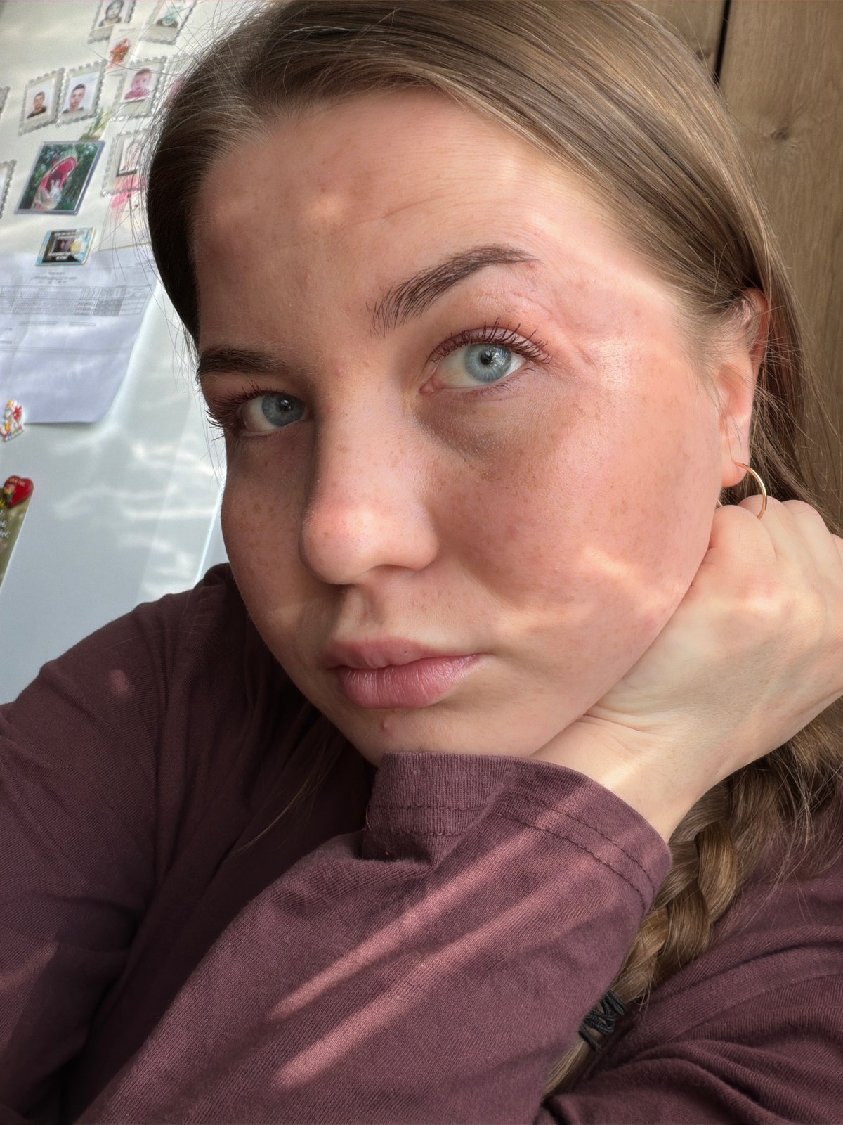 Woman takes selfies, worker handles equipment in Уральское