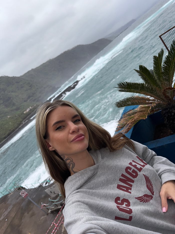 Tourists document stormy coastal scenes at Mesa del Mar