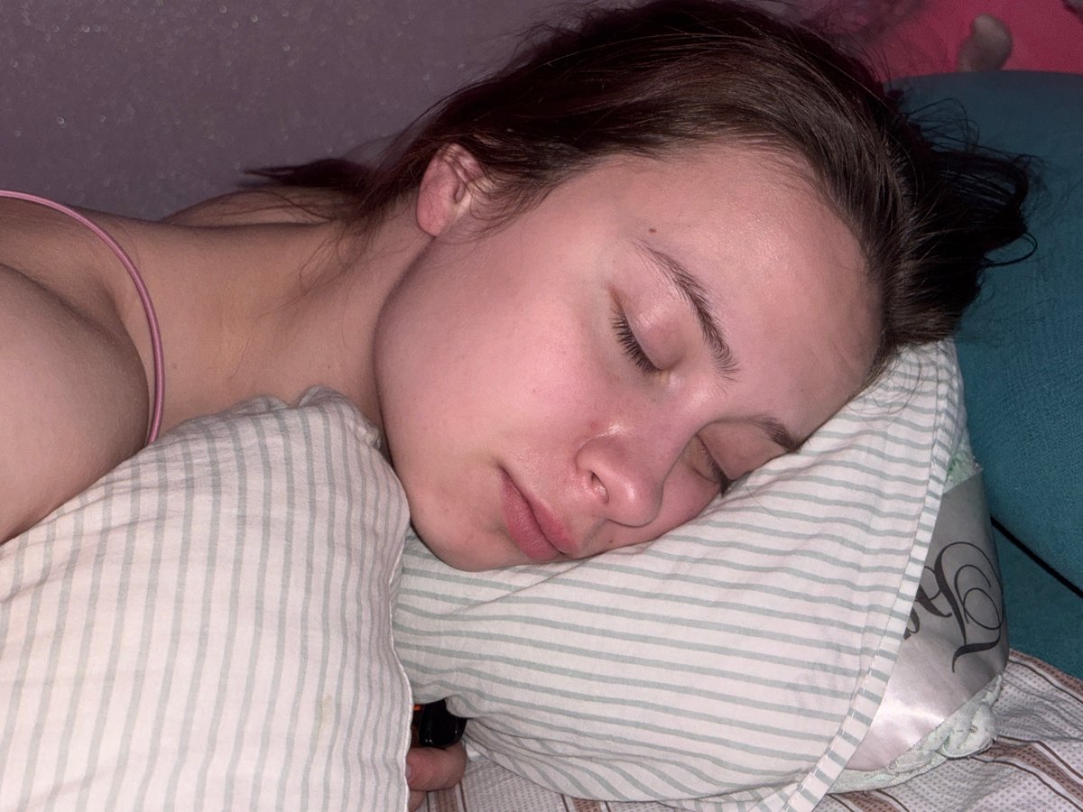 Person sleeps peacefully in bed in Russian town
