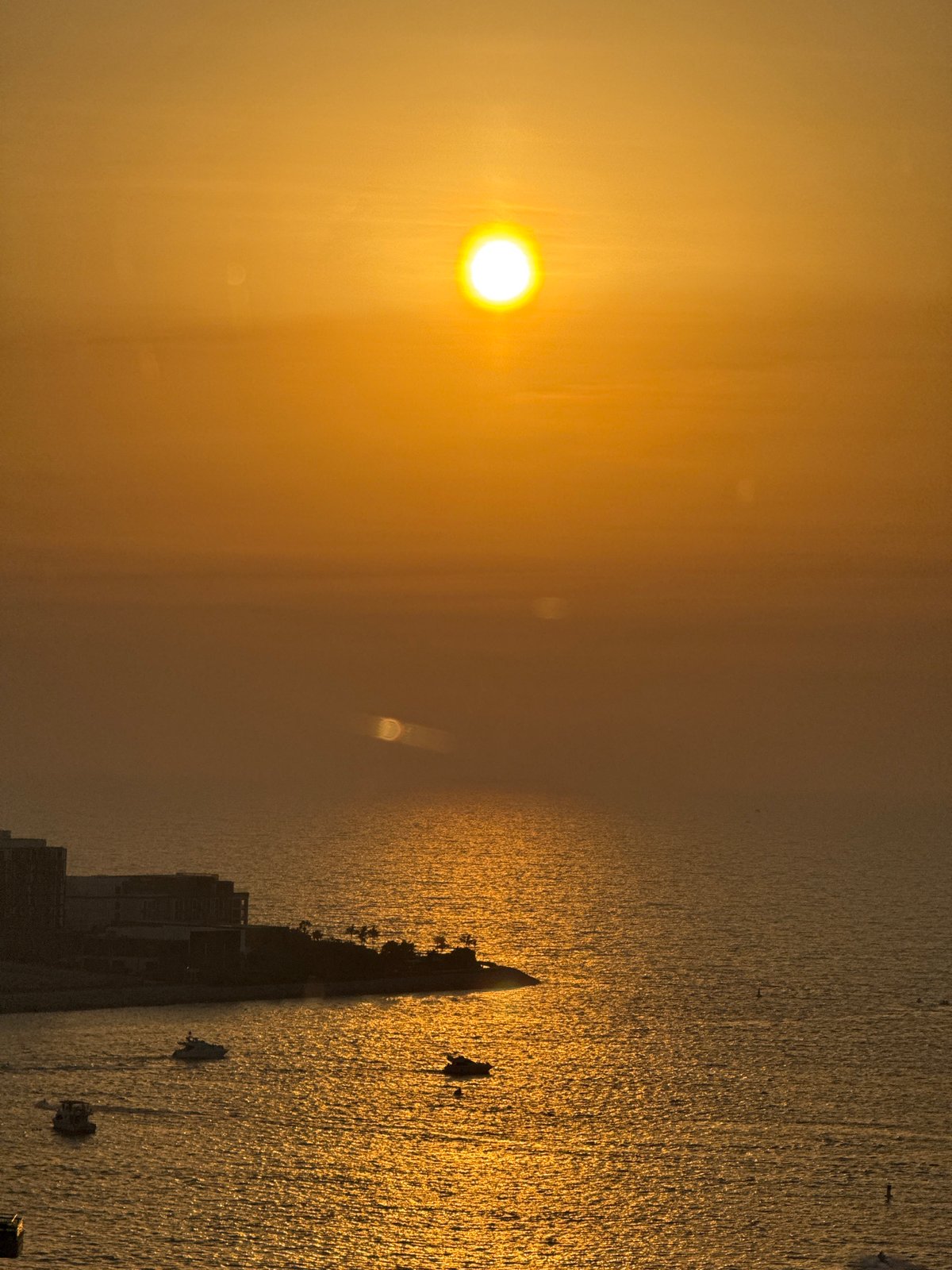 Sunset over the Arabian Gulf, Ain Dubai in the frame