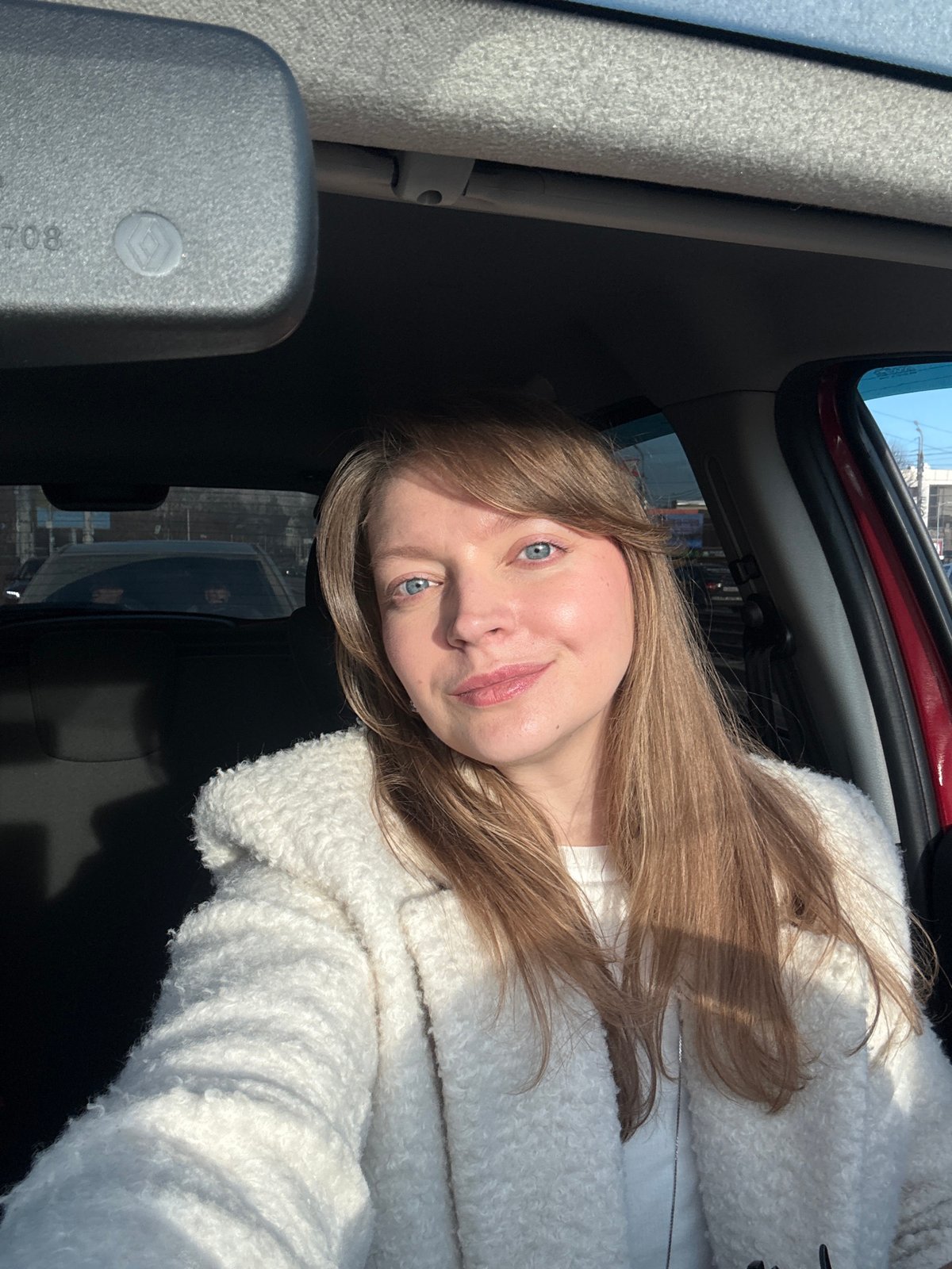 Woman takes car selfie in Izhevsk