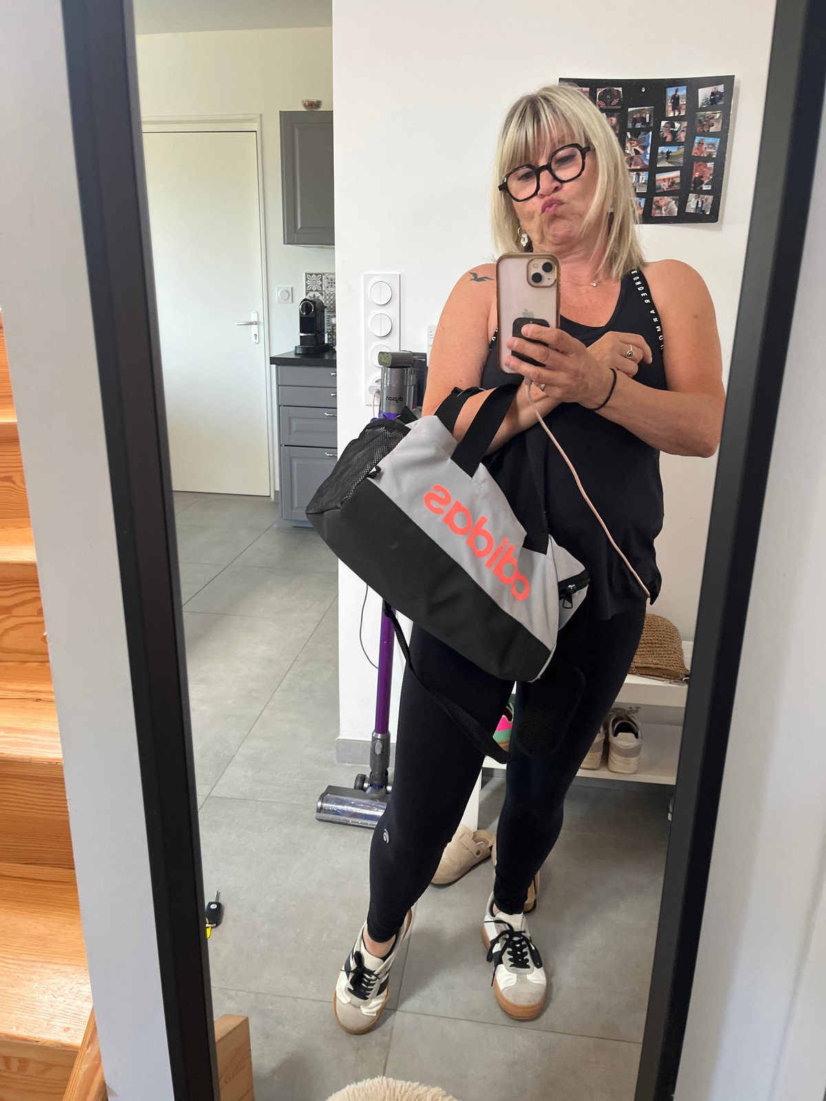 Woman takes mirror selfie in Chambœuf indoor location