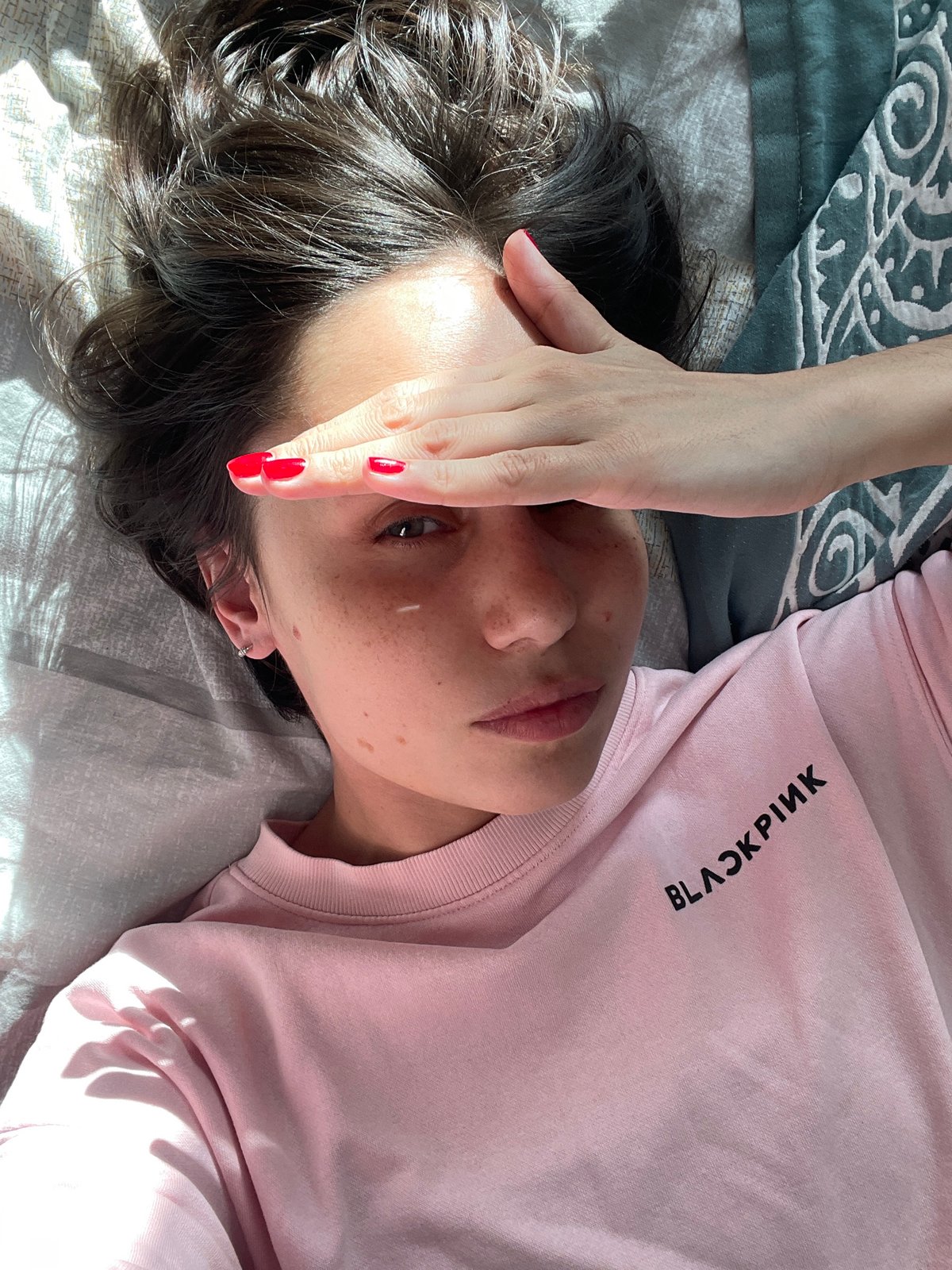 Woman resting on bed captured in Izhevsk moment